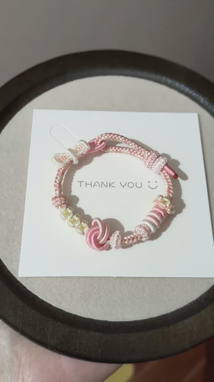 Braccialiale in cordino intrecciato a mano sfumatura rosa bianco