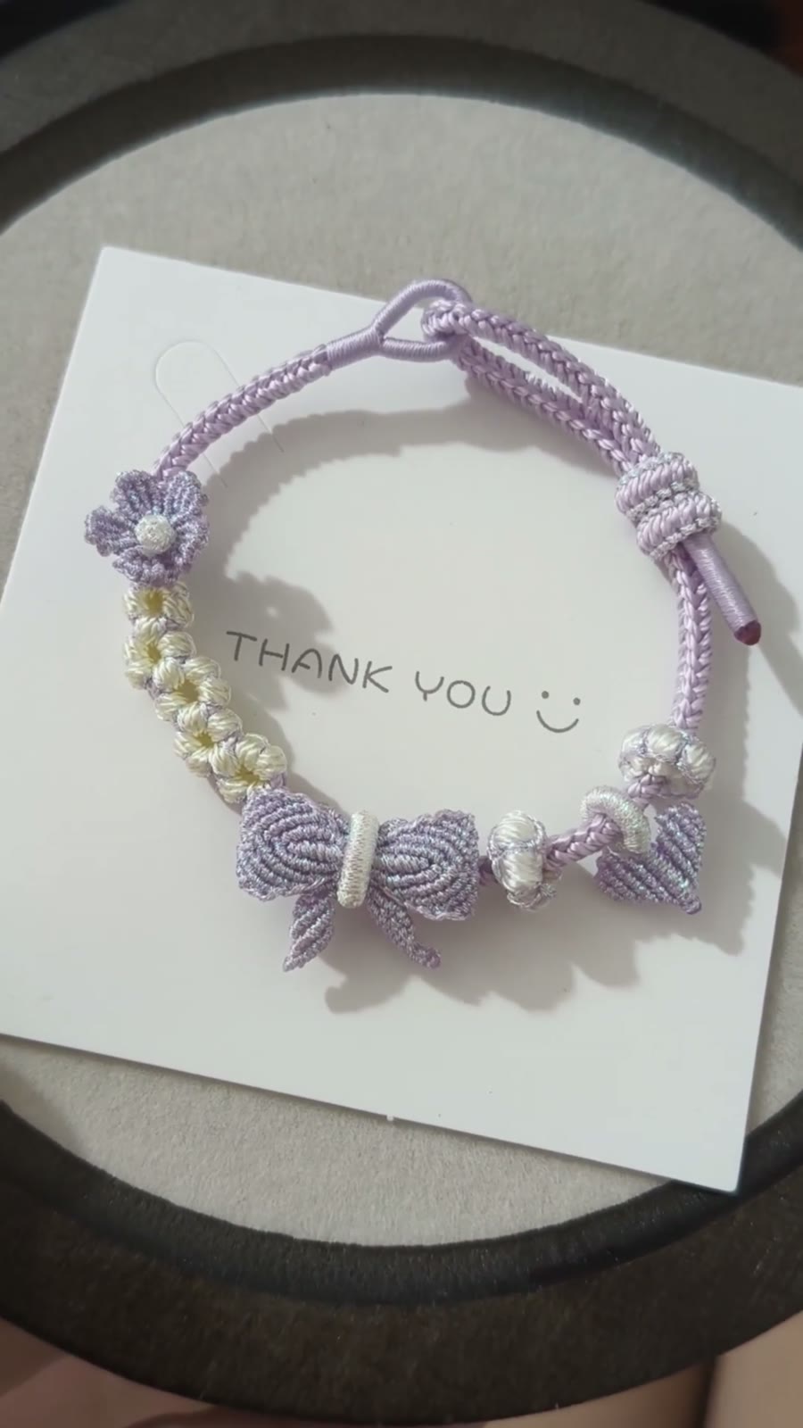 Braccialiale in cordino con sfumatura viola e bianco