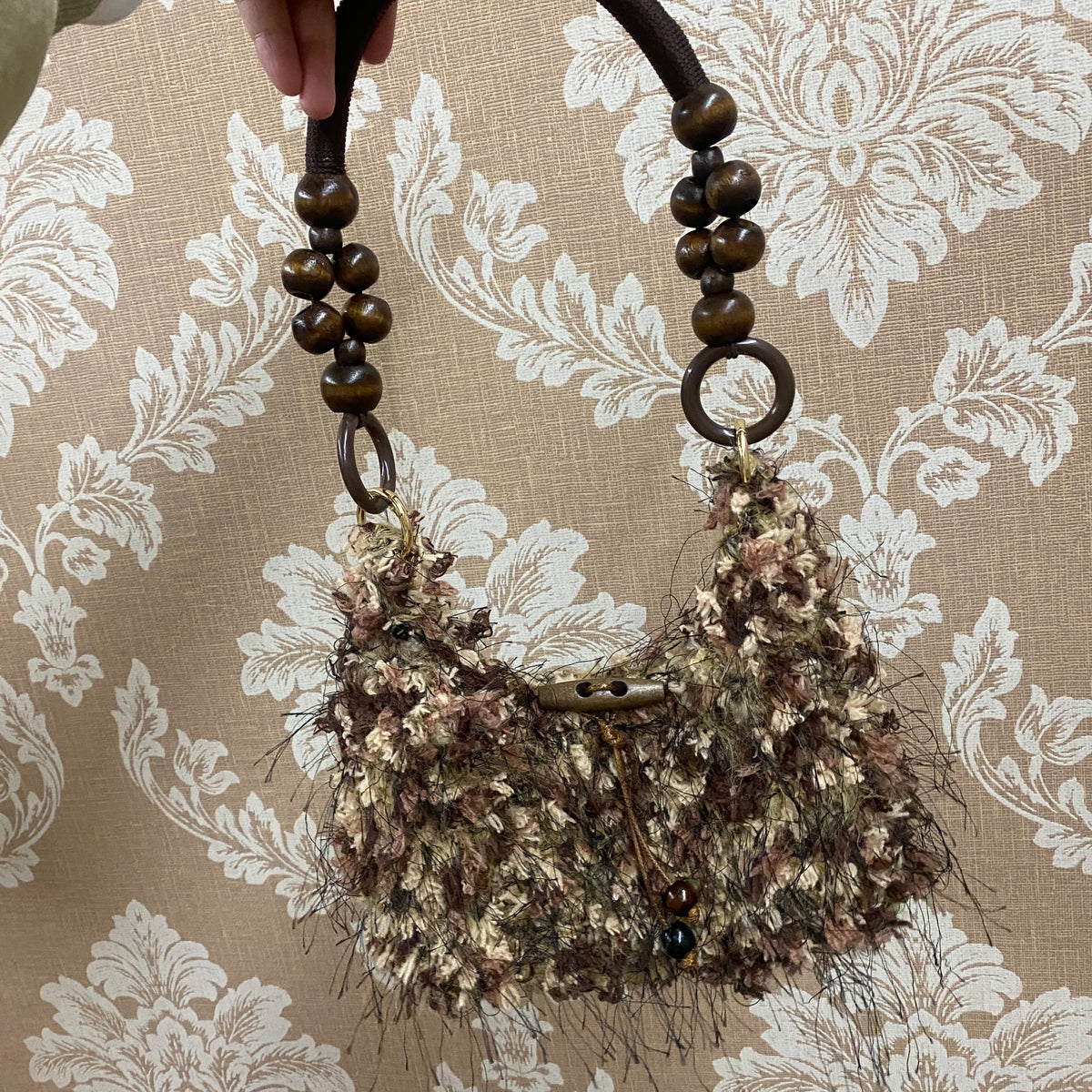 Kleine geweven crescent hobo handtas
