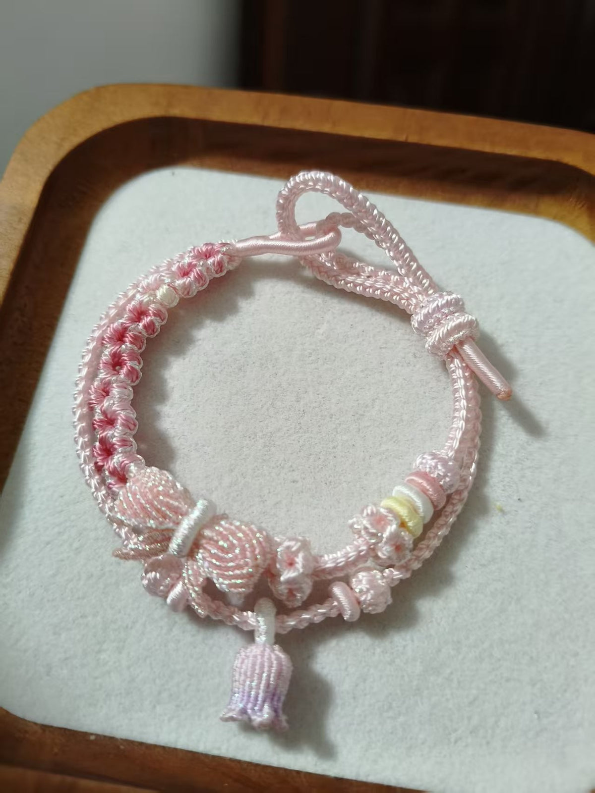 Handwoven Pink Gradient Bracelet with Floral Decor