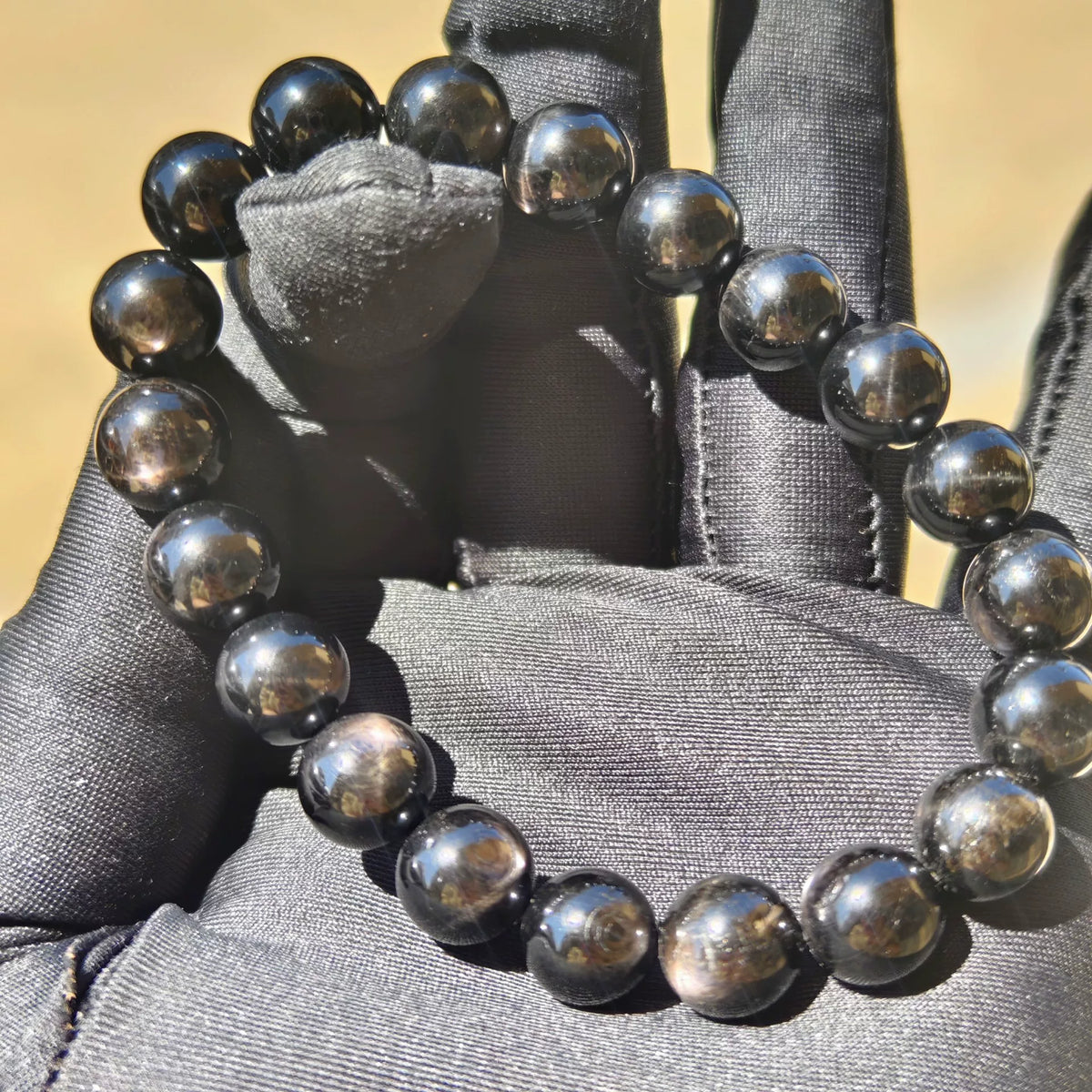 Schwarzes Goldstein Perlenarmband 10mm