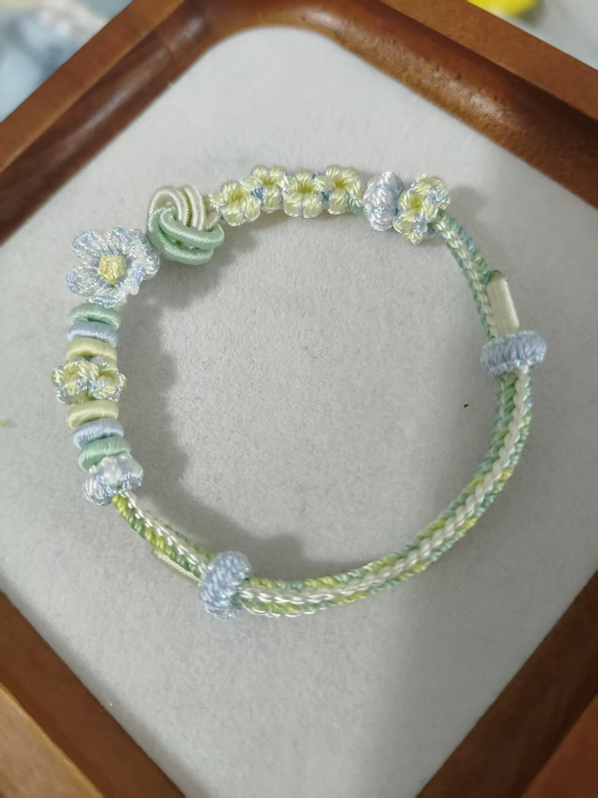 Handwoven Gradient Bracelet with Floral Decor
