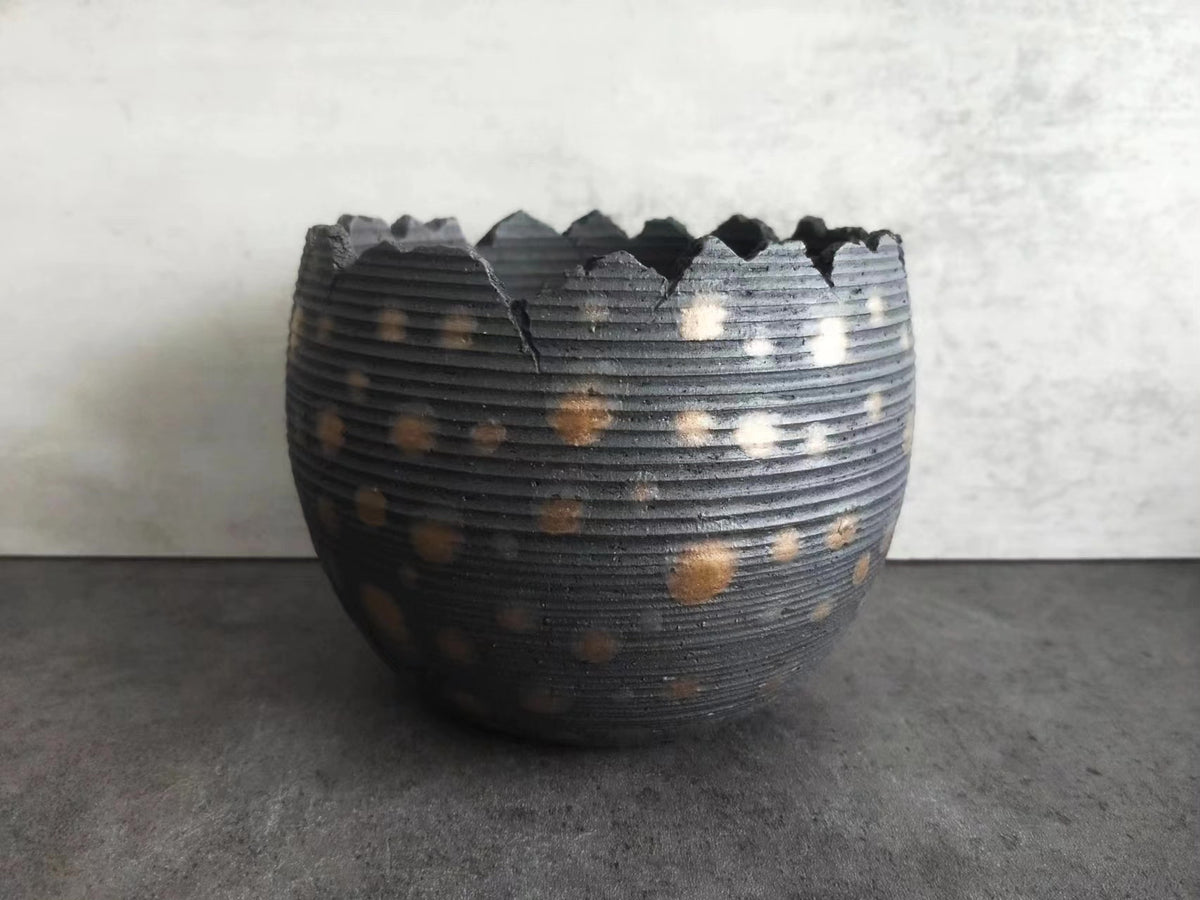 Handcrafted Ceramic Vessel with Serrated Rim