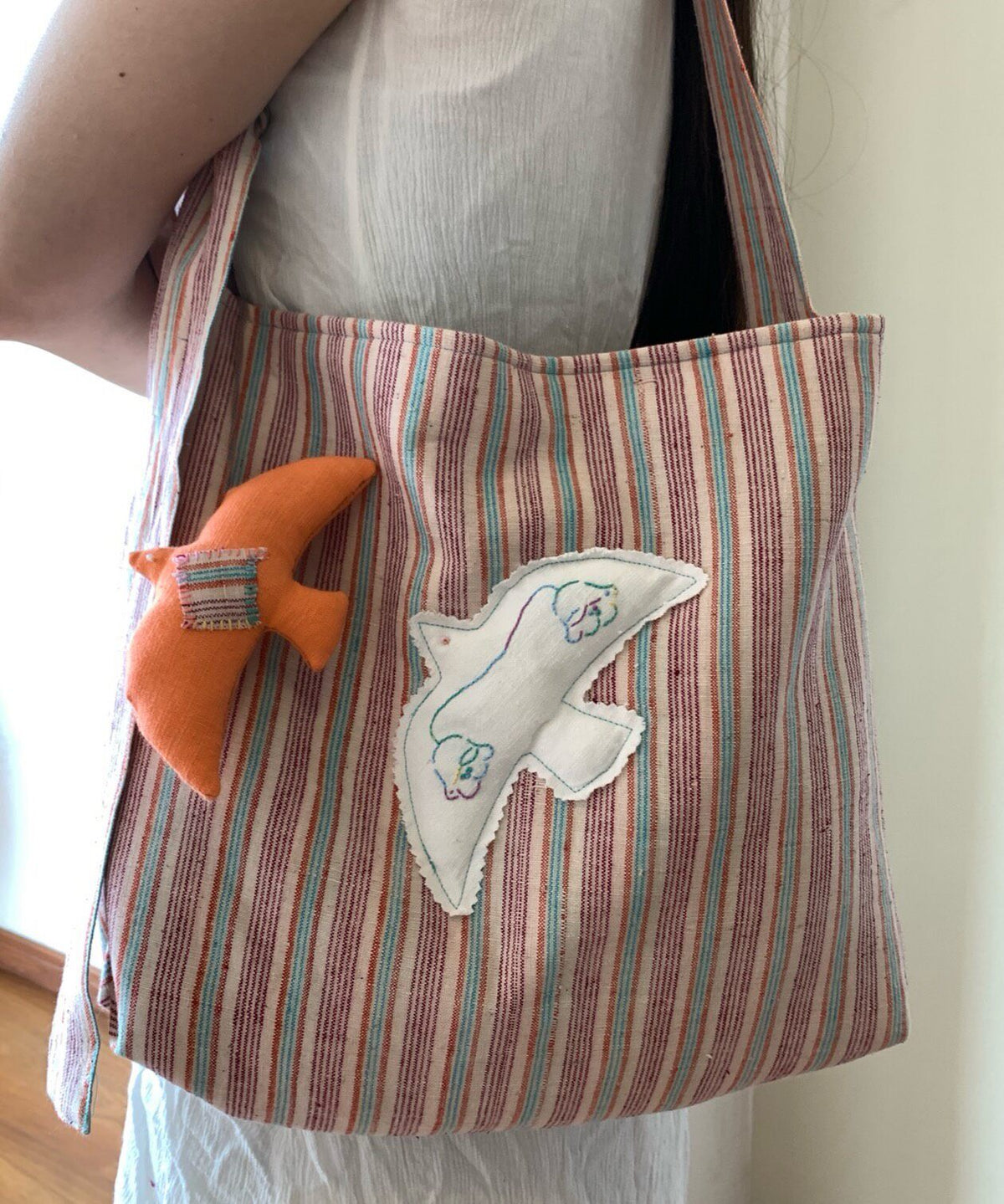 Handwoven Striped Shoulder Bag with Bird Applique