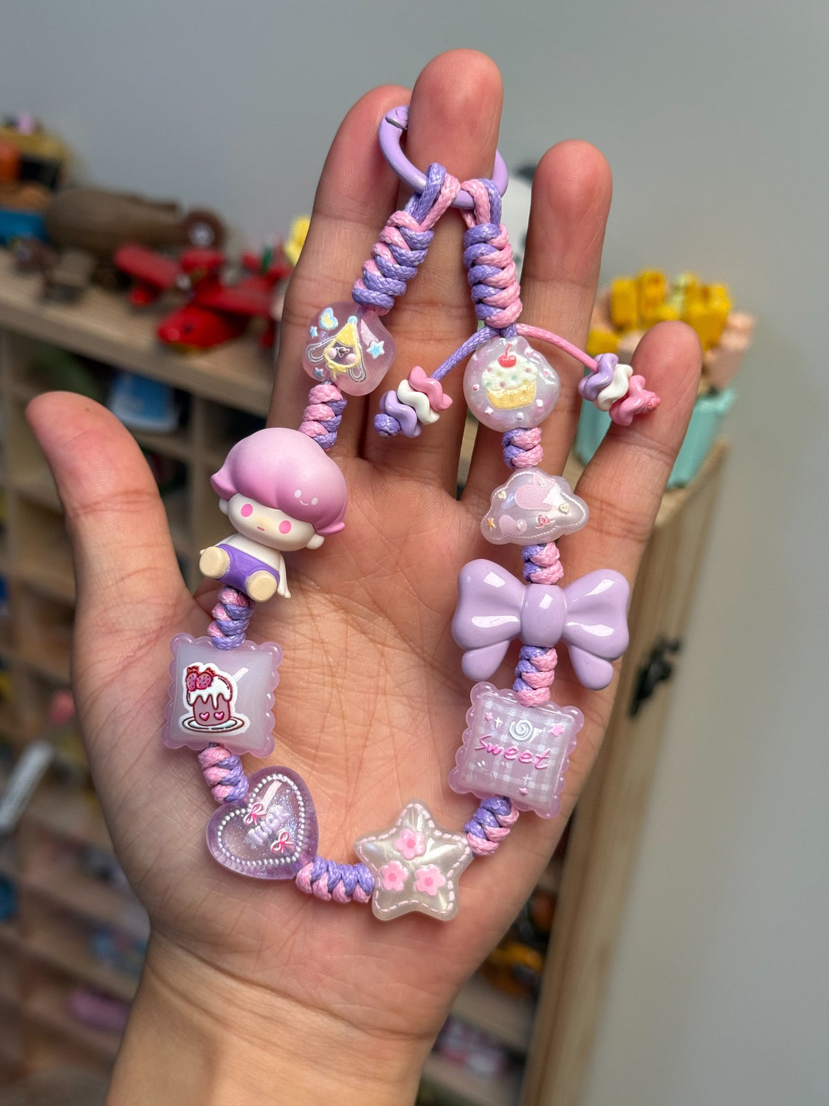 Dimoo Purple Seated Figure Braided Phone Strap