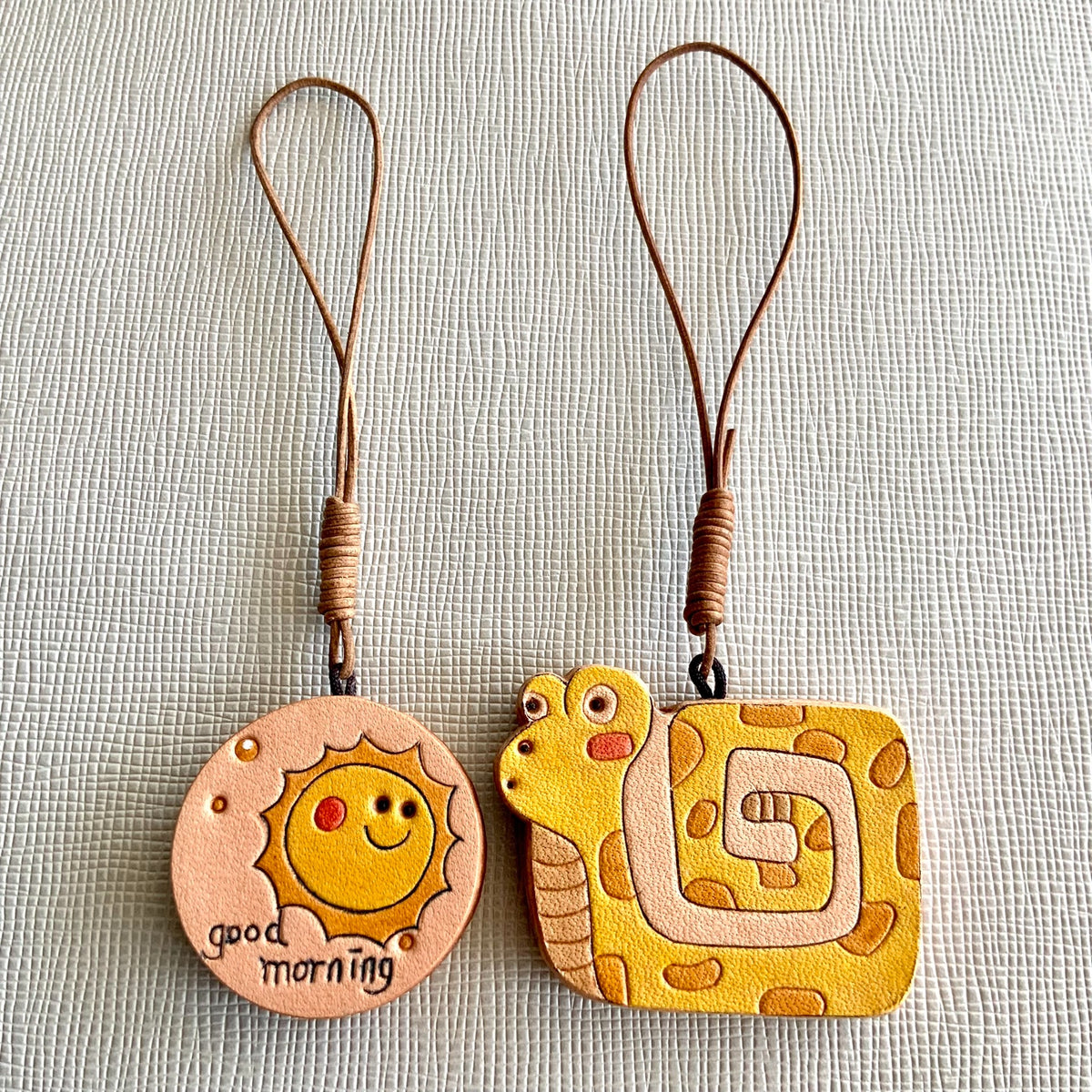 Leren Slang en Zon Charm Set