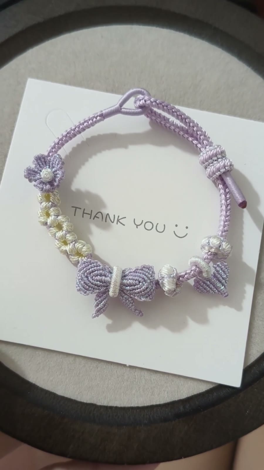 Braccialiale in cordino con sfumatura viola e bianco