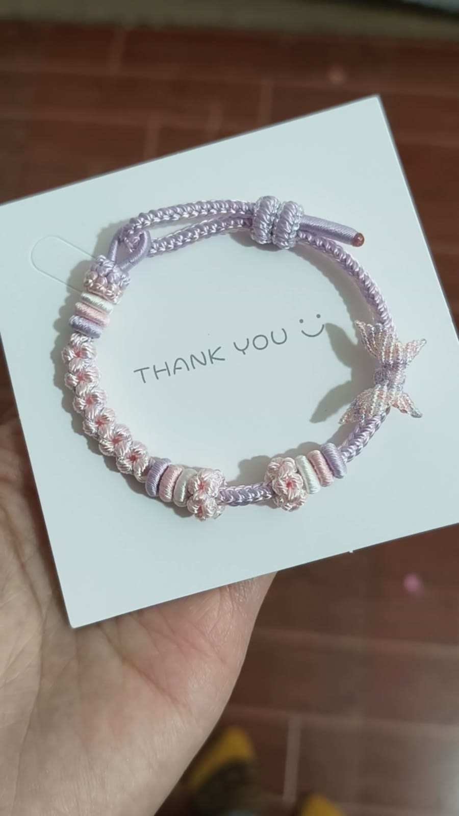Handgeweven roze-naar-lila cord armband
