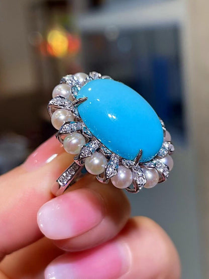 18K Gold Ring with Oval Cabochon Blue Sleeping Beauty Turquoise, Pearl Halo, and Diamond Accents