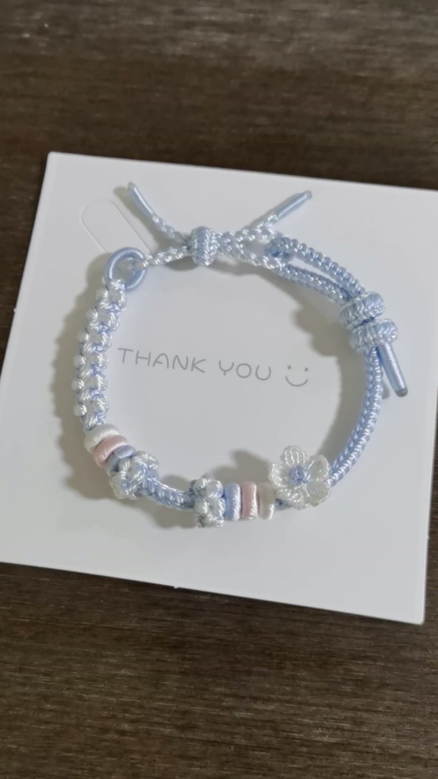 Handwoven Blue Gradient Bracelet with Flower Charm