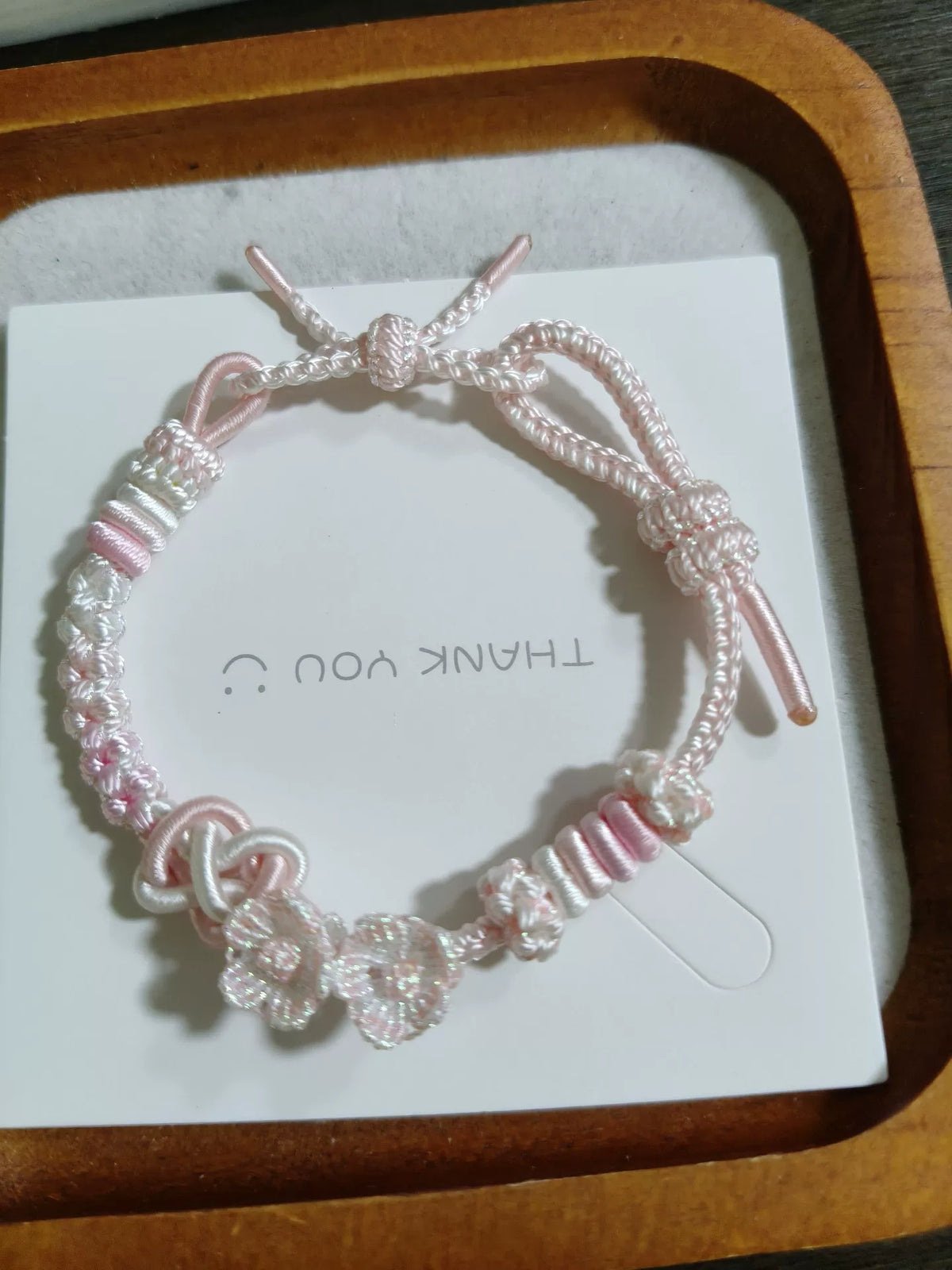 Handgewoven roze-wit verloop armbandkoord