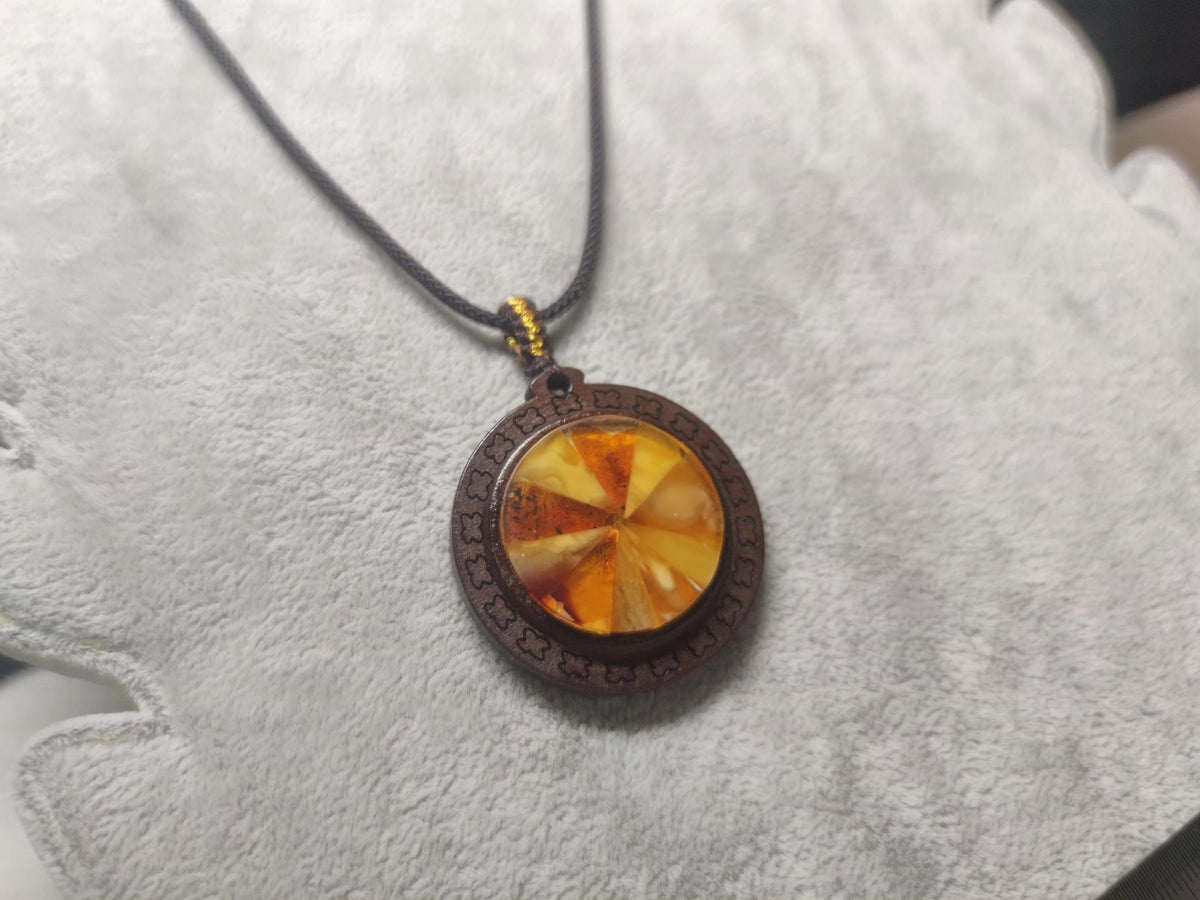 Spliced Amber Pendant with Wooden Frame