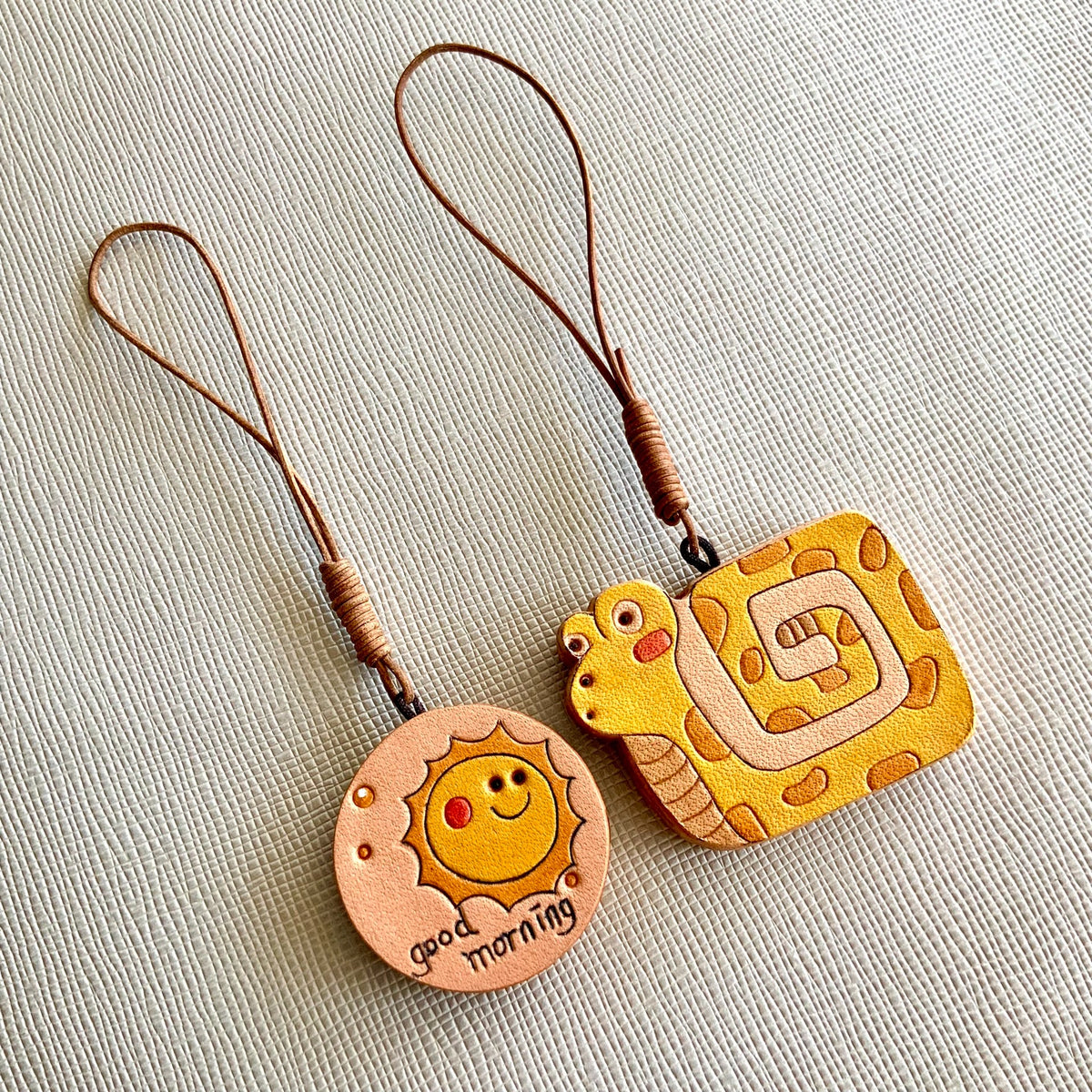 Leren Slang en Zon Charm Set