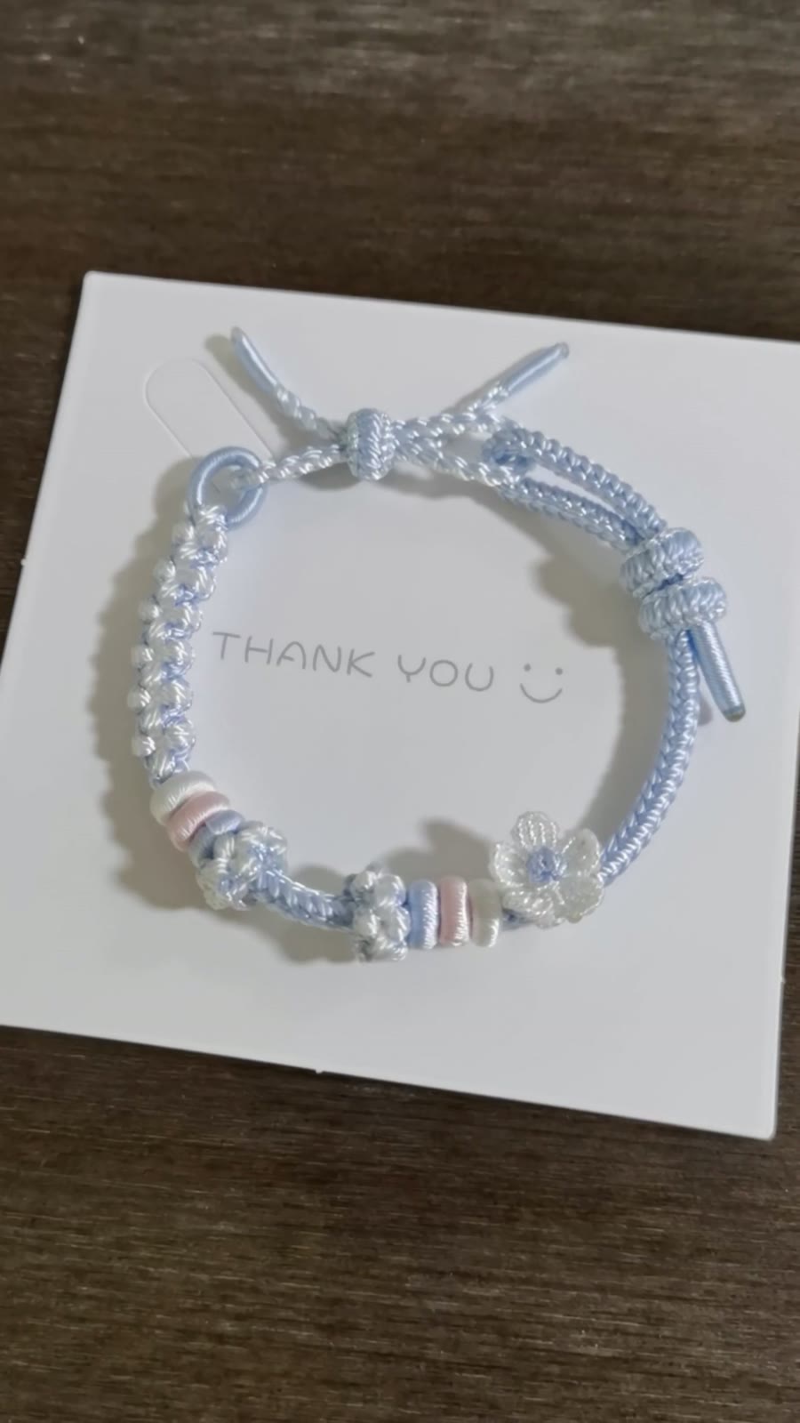 Handwoven Blue Gradient Bracelet with Flower Charm