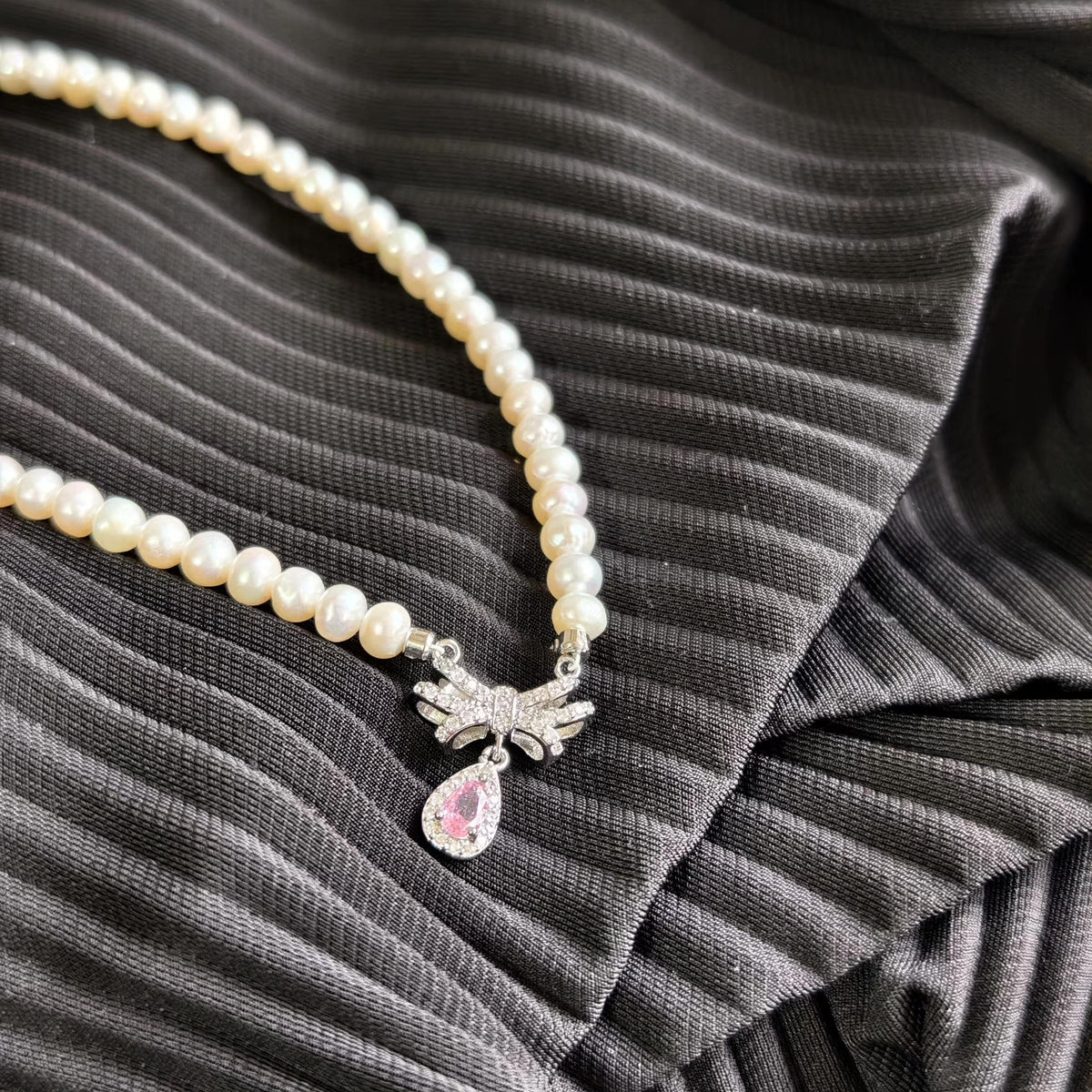 Pearl Necklace with Pink Bow Pendant