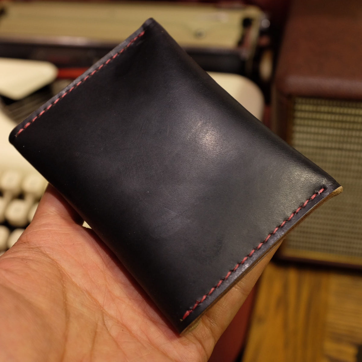 Black Horween Leather Bifold Wallet with Brass Snap Closure