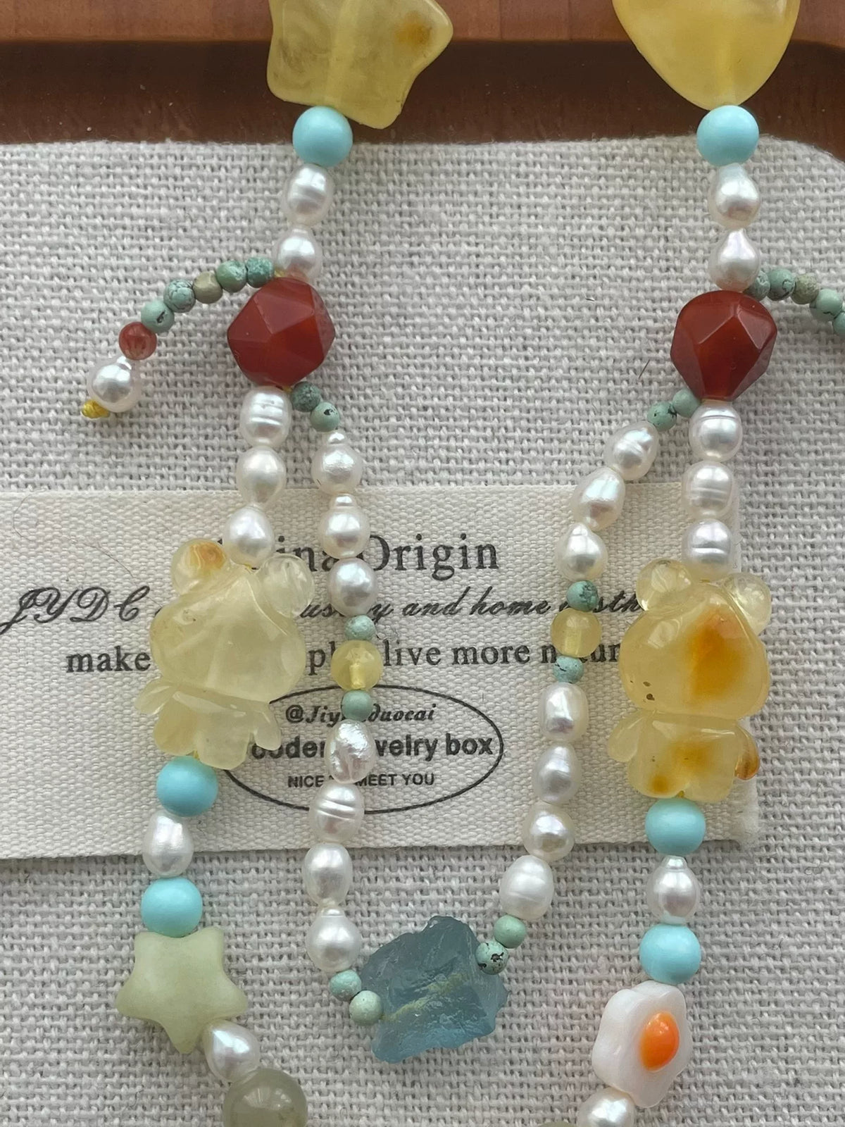 Collier double rang ours en ambre, perles et turquoise