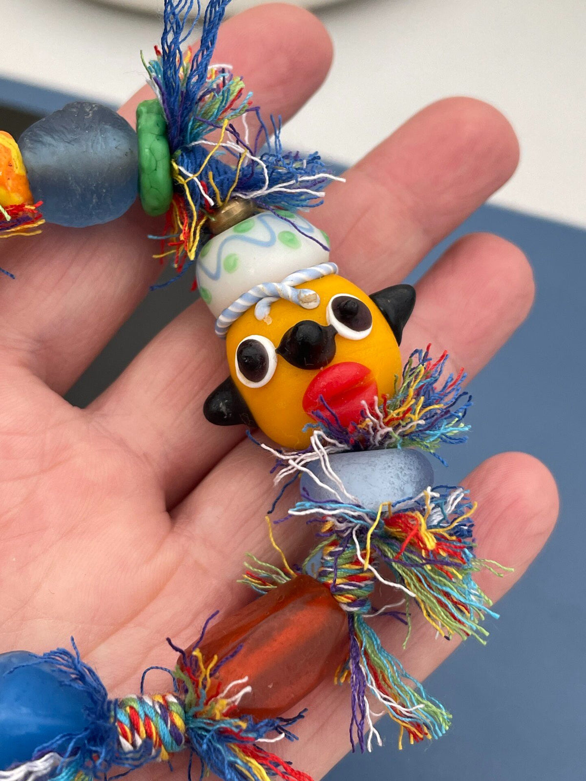 Handcrafted Glass Bead Bracelet With Yellow Doll Head