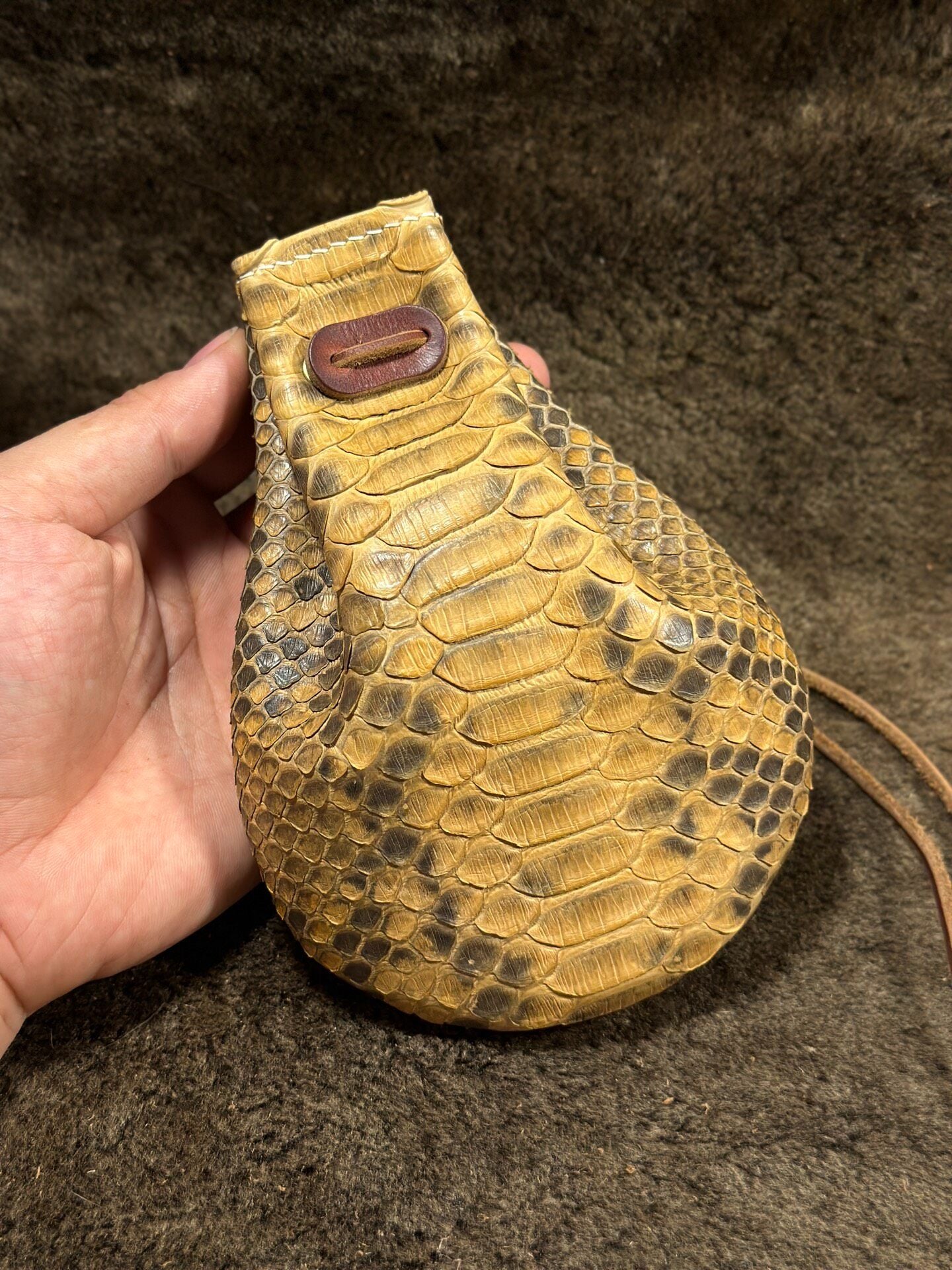 Artisanal Leather Pouch with Dragon Scale Texture and Adjustable Opening