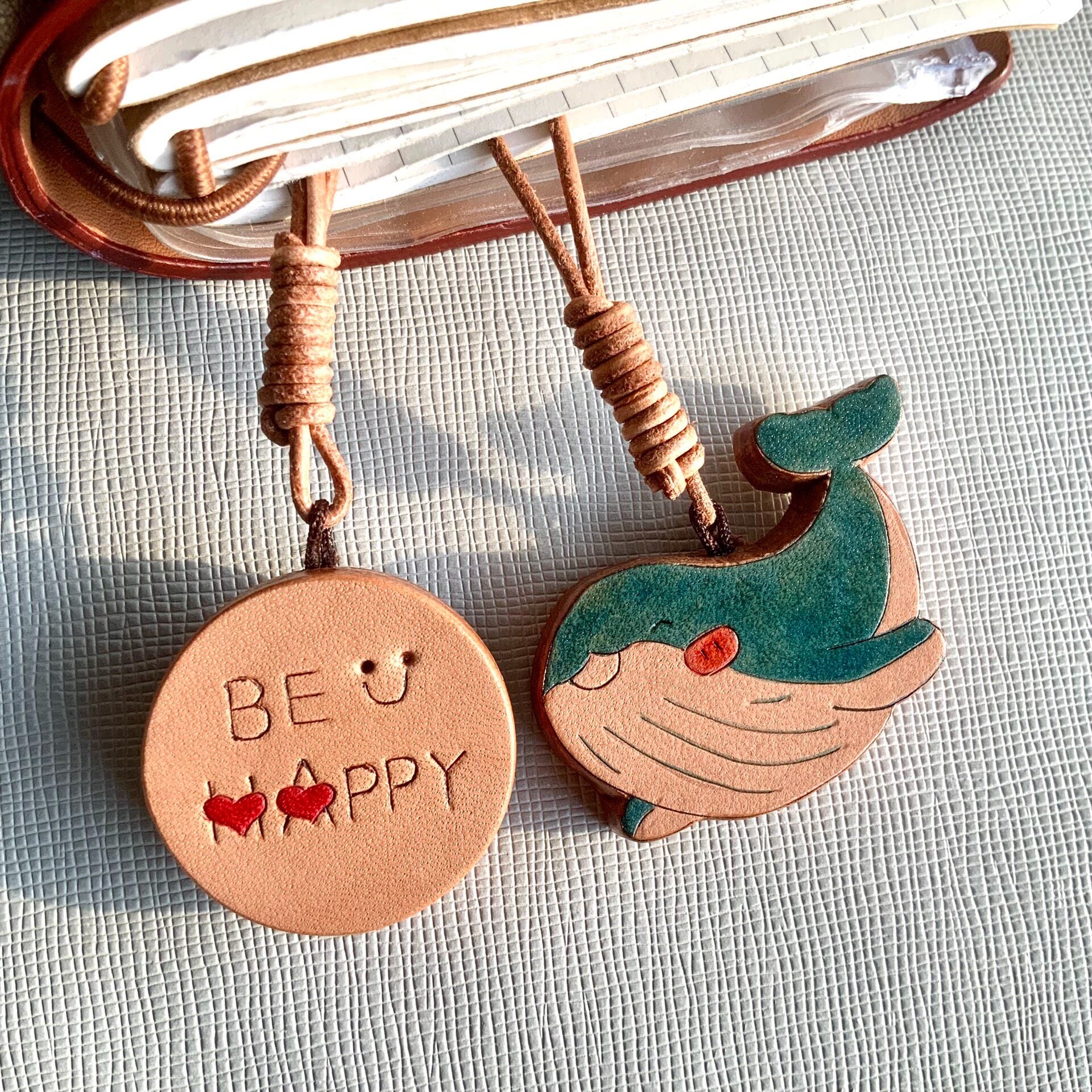 Handcrafted Leather Pendants: "BE HAPPY" Disc and Whale Charm