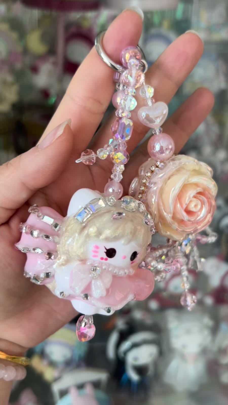 Roze Kraalpop Telefoonhanger met Strass Roos
