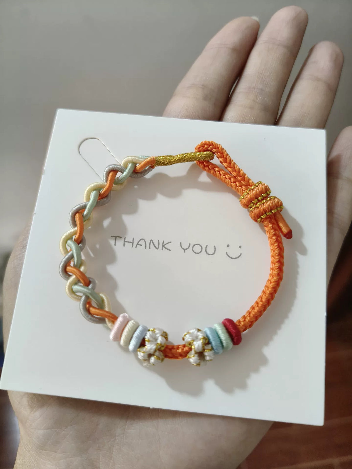 Pulsera de cordón tejida a mano en degradado naranja y gris