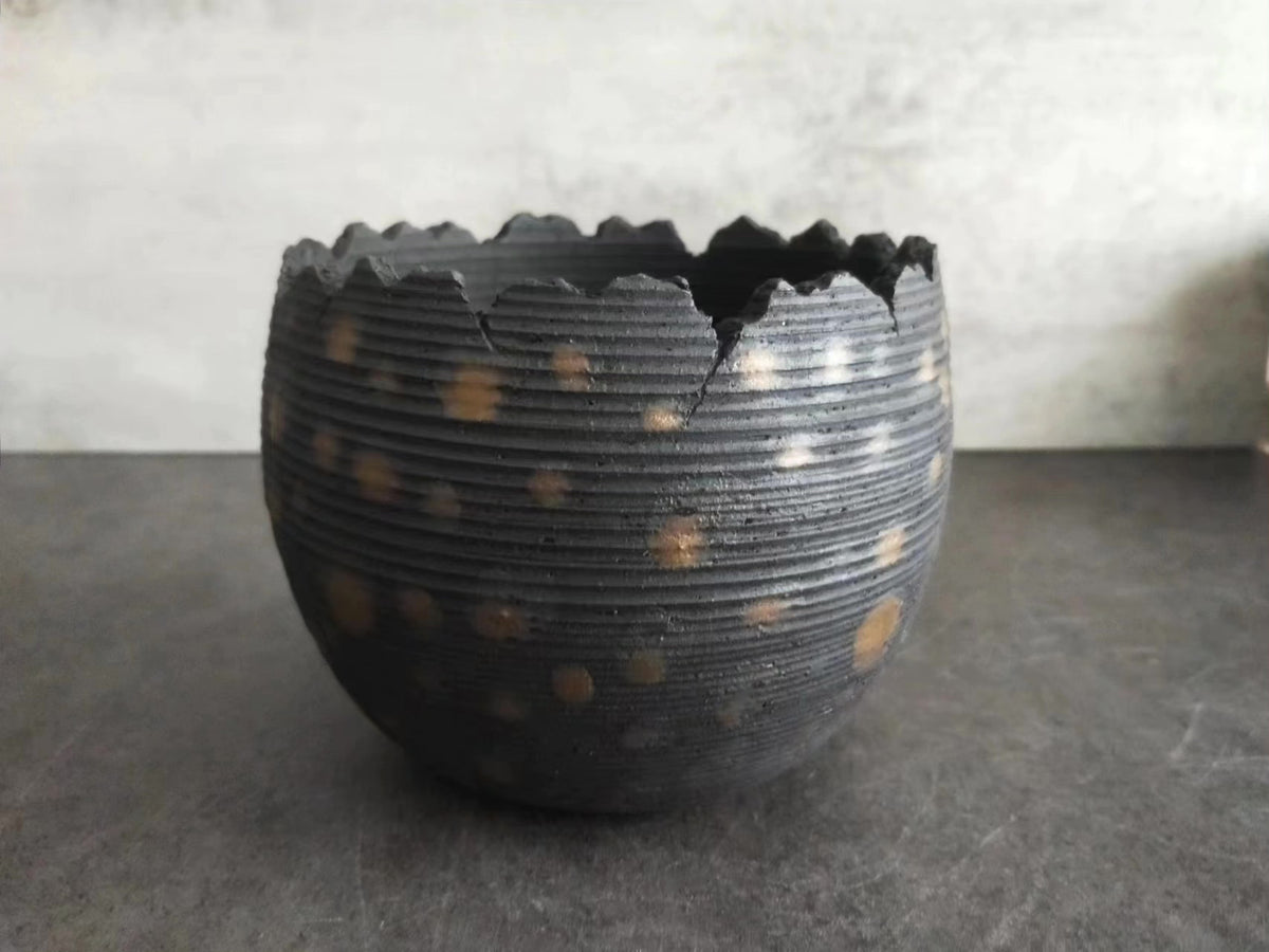 Handcrafted Ceramic Vessel with Serrated Rim