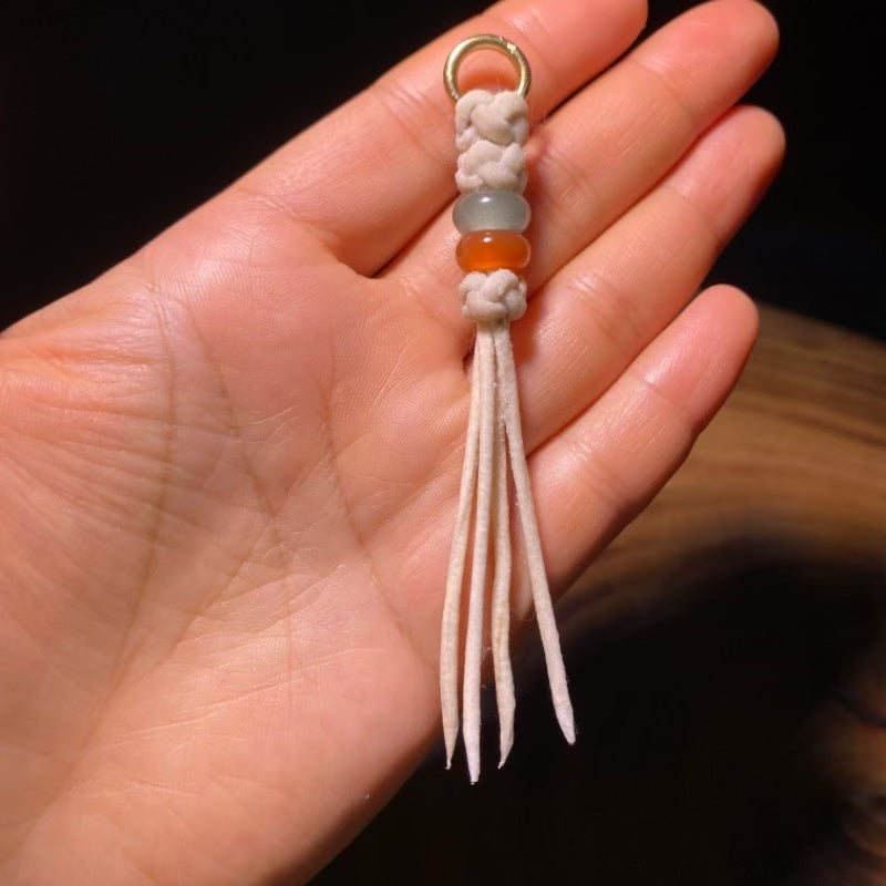 Handcrafted Tibetan Tassel with White Leather Cord and Green and Amber Beads