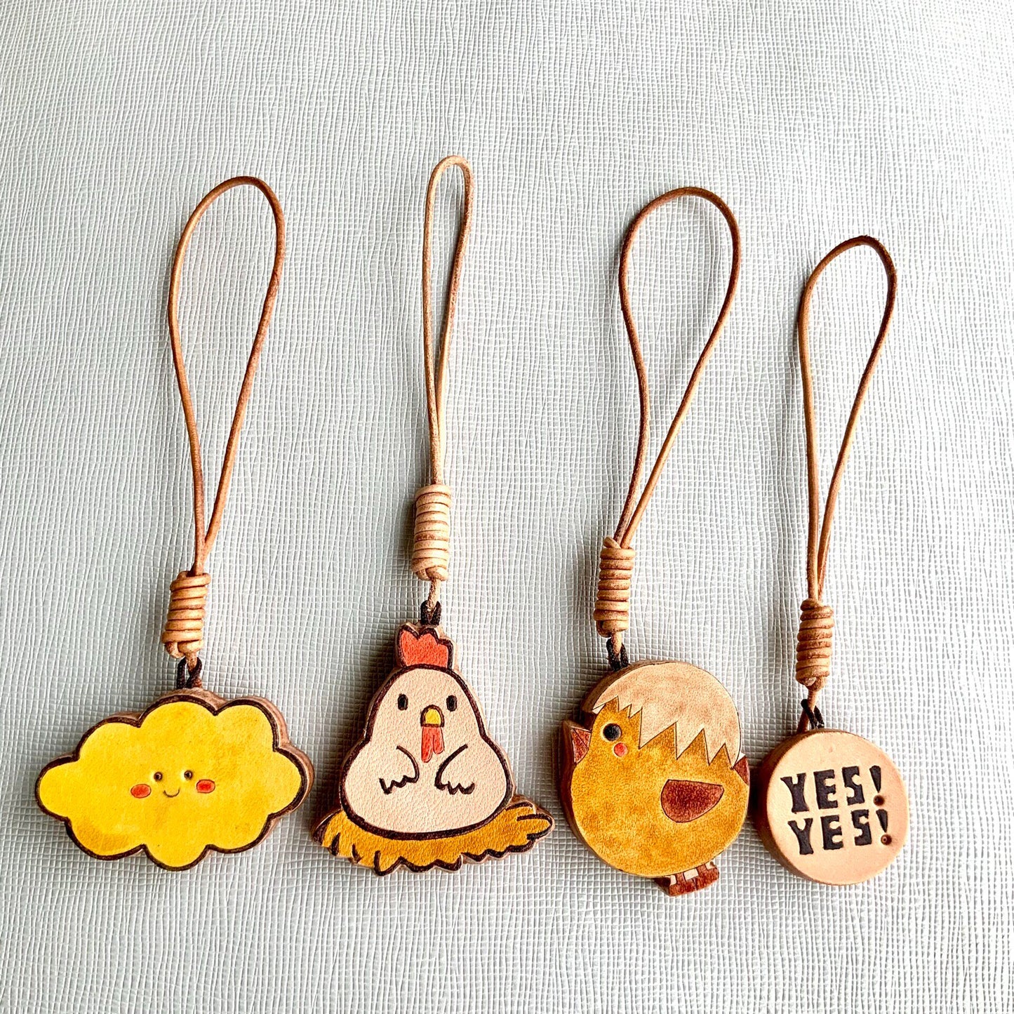 Handcrafted Leather Charm Set with Cartoon Motifs