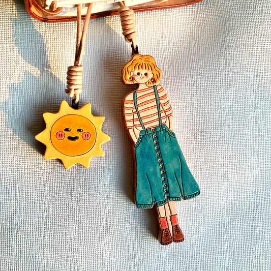 Hand-Painted Leather Girl and Sun Bag Charms