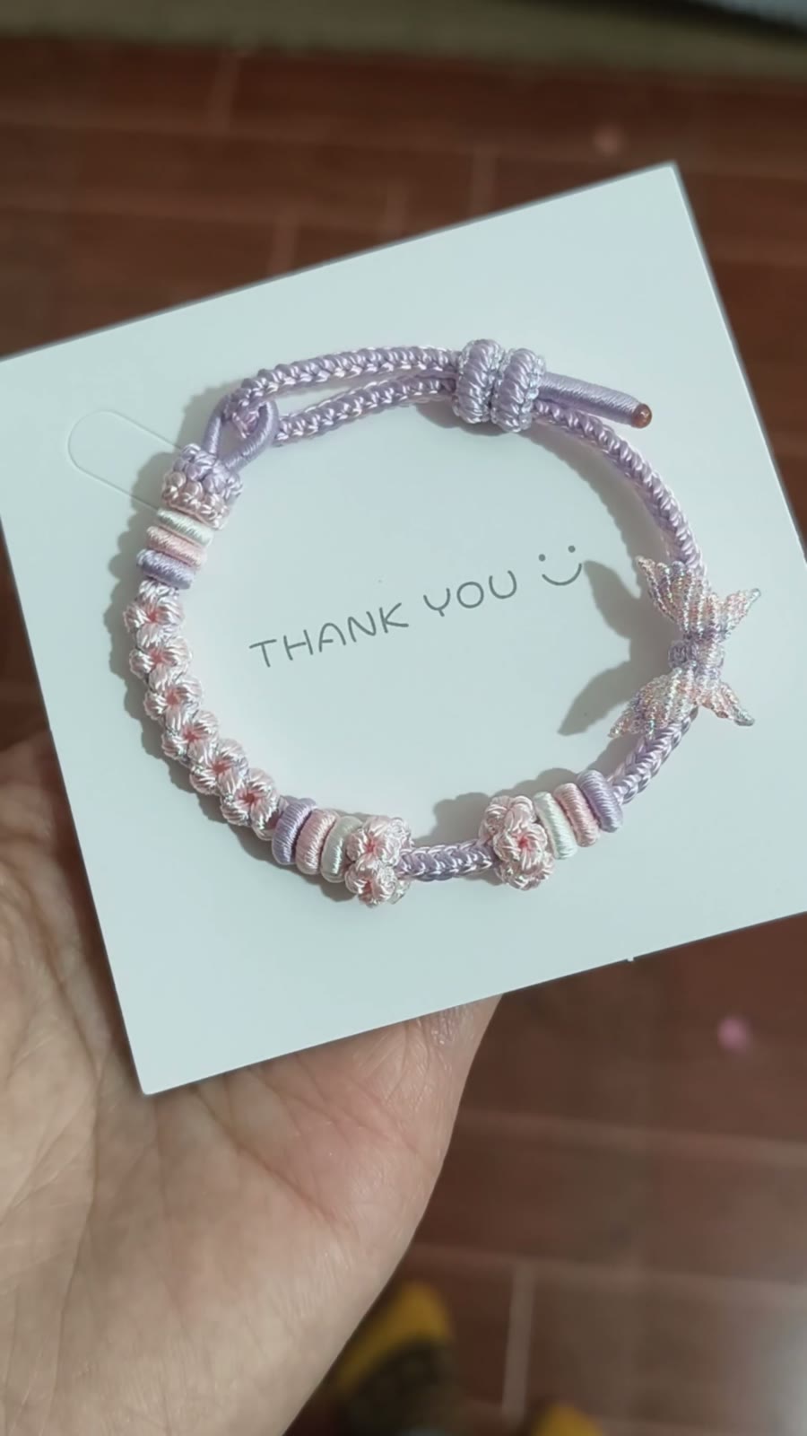 Handgeweven roze-naar-lila cord armband