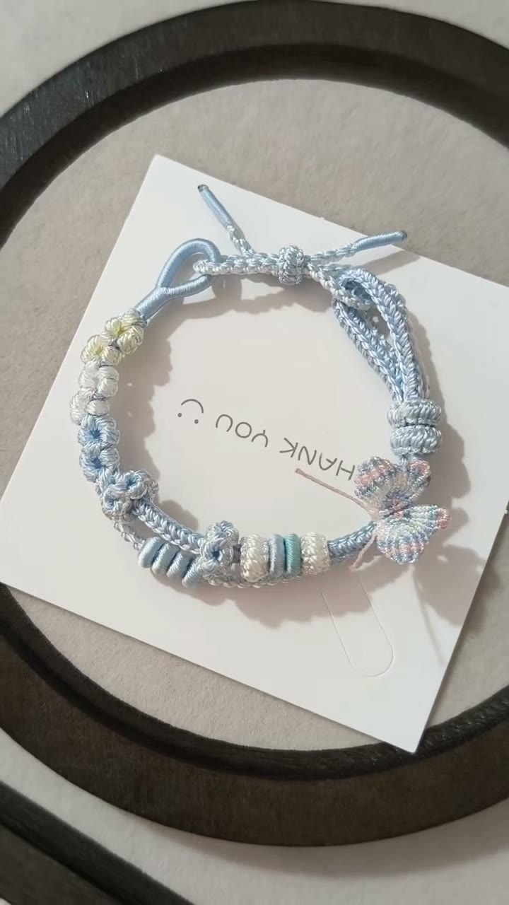 Handwoven Light Blue Bracelet with Floral Decor