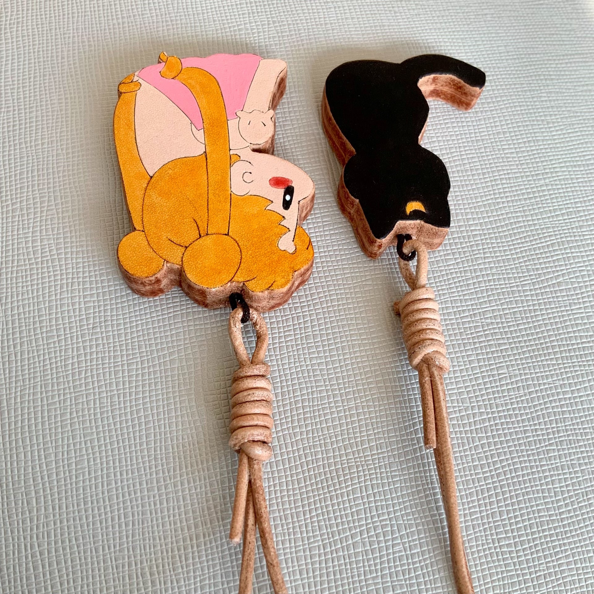 Two Thick Leather Keychain Pendants: Black Cat and Blonde Girl