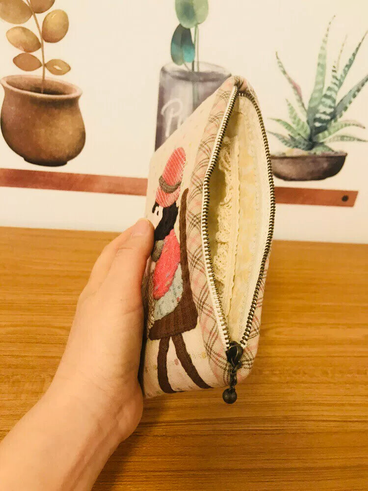 Estuche con cremallera de tejido teñido de hilo hecho a mano