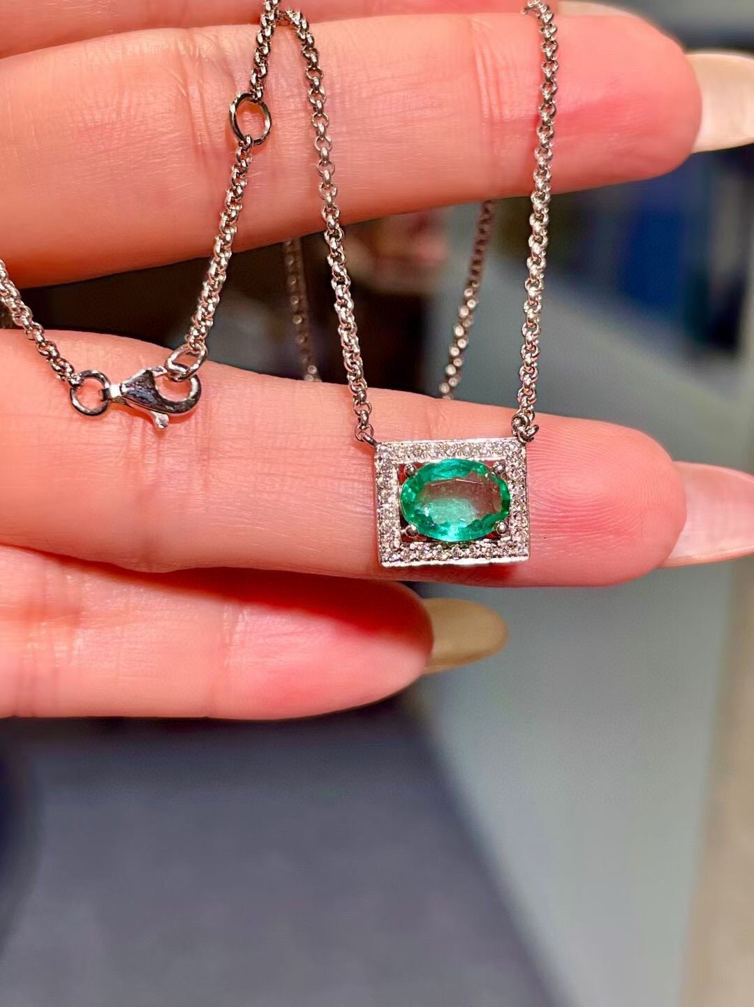 Platinum Pendant Necklace with 0.98 Carat Oval Emerald and Diamond Halo