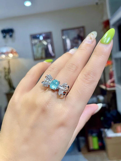 18k Gold Ring with Cushion-Cut Neon Blue Gem, Diamond and Pearl Bow-Tie Wings