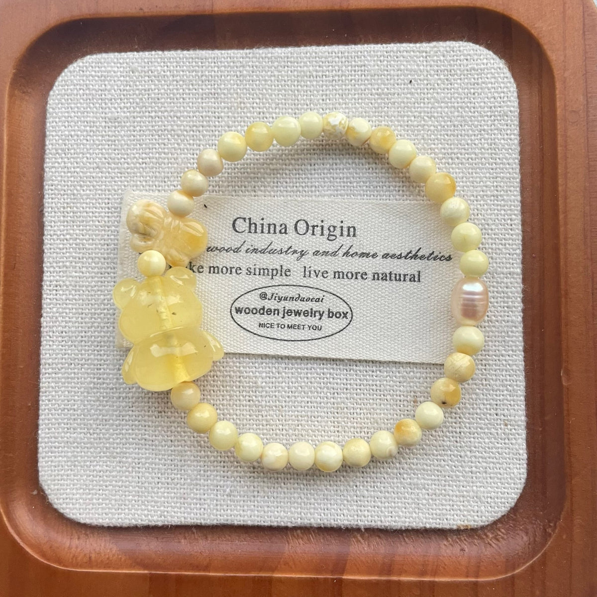 Braccialiale in ambra da cera d'api naturale con orso