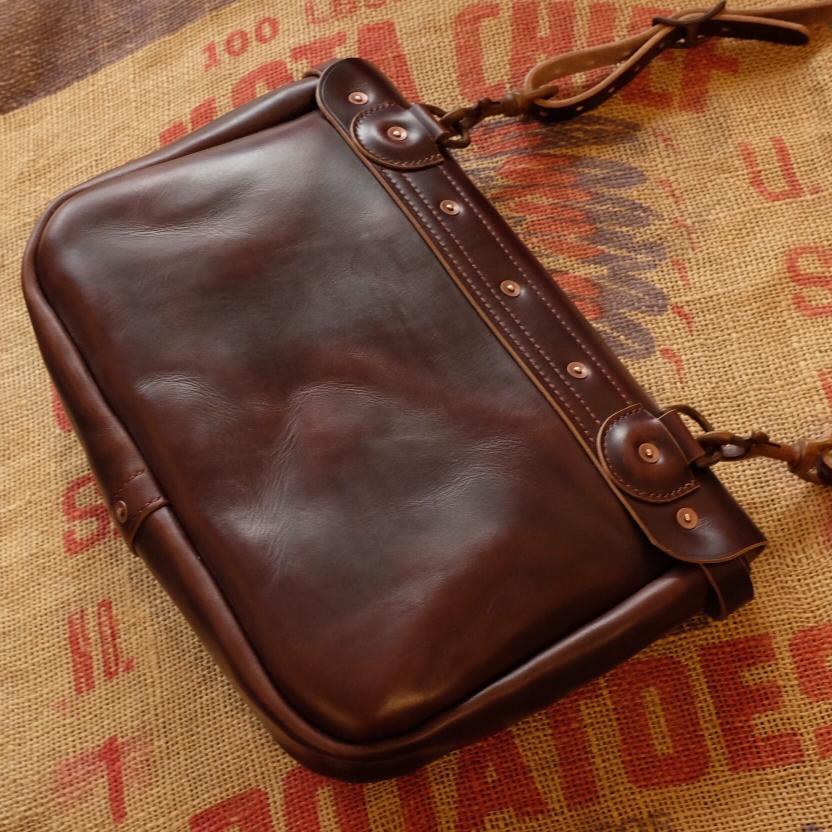 Rich Brown Leather Messenger Bag with Brass Buckle Closure