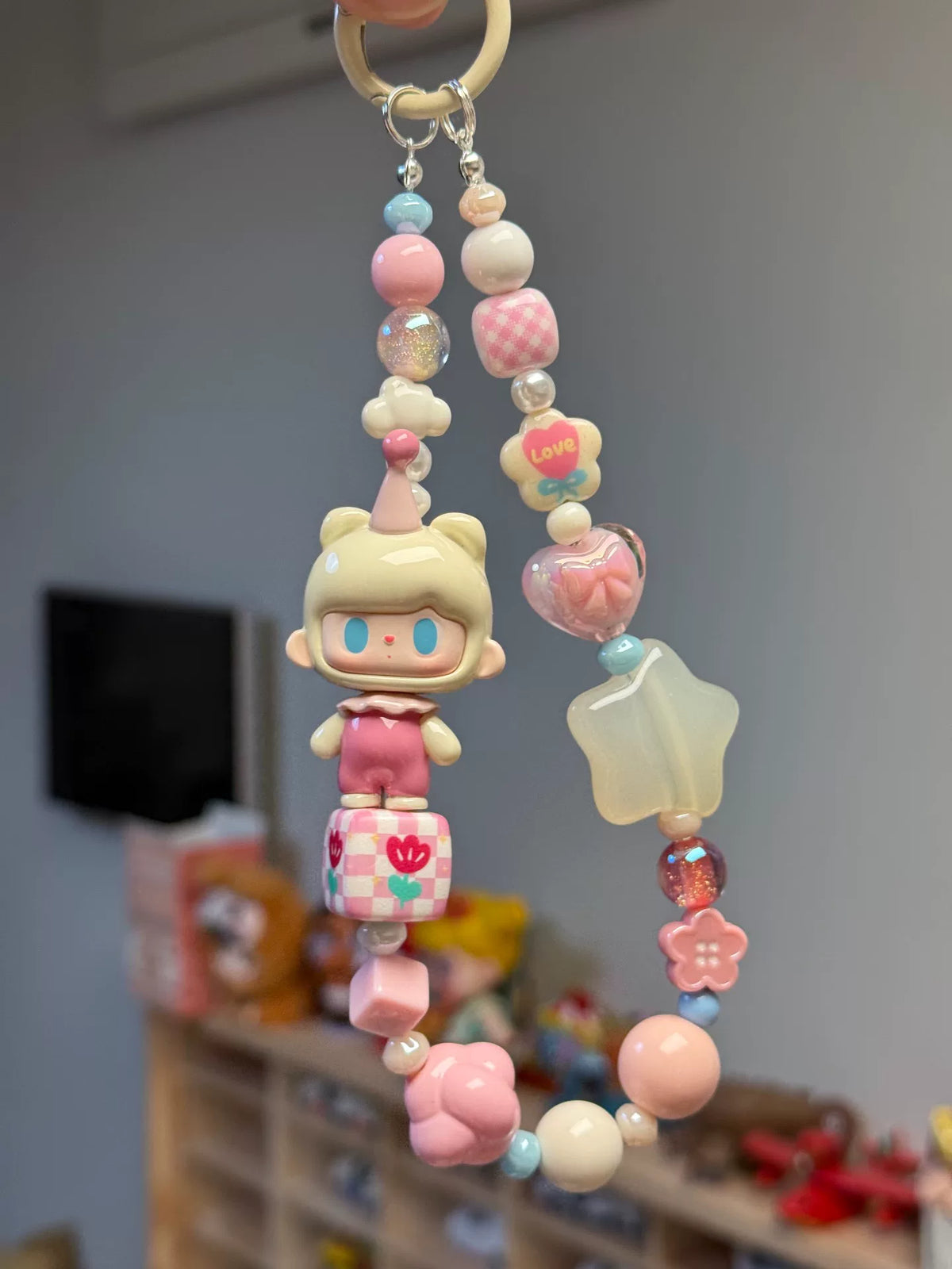 Dragonne de téléphone et porte-clés aux perles et personnage à capuche d'ours