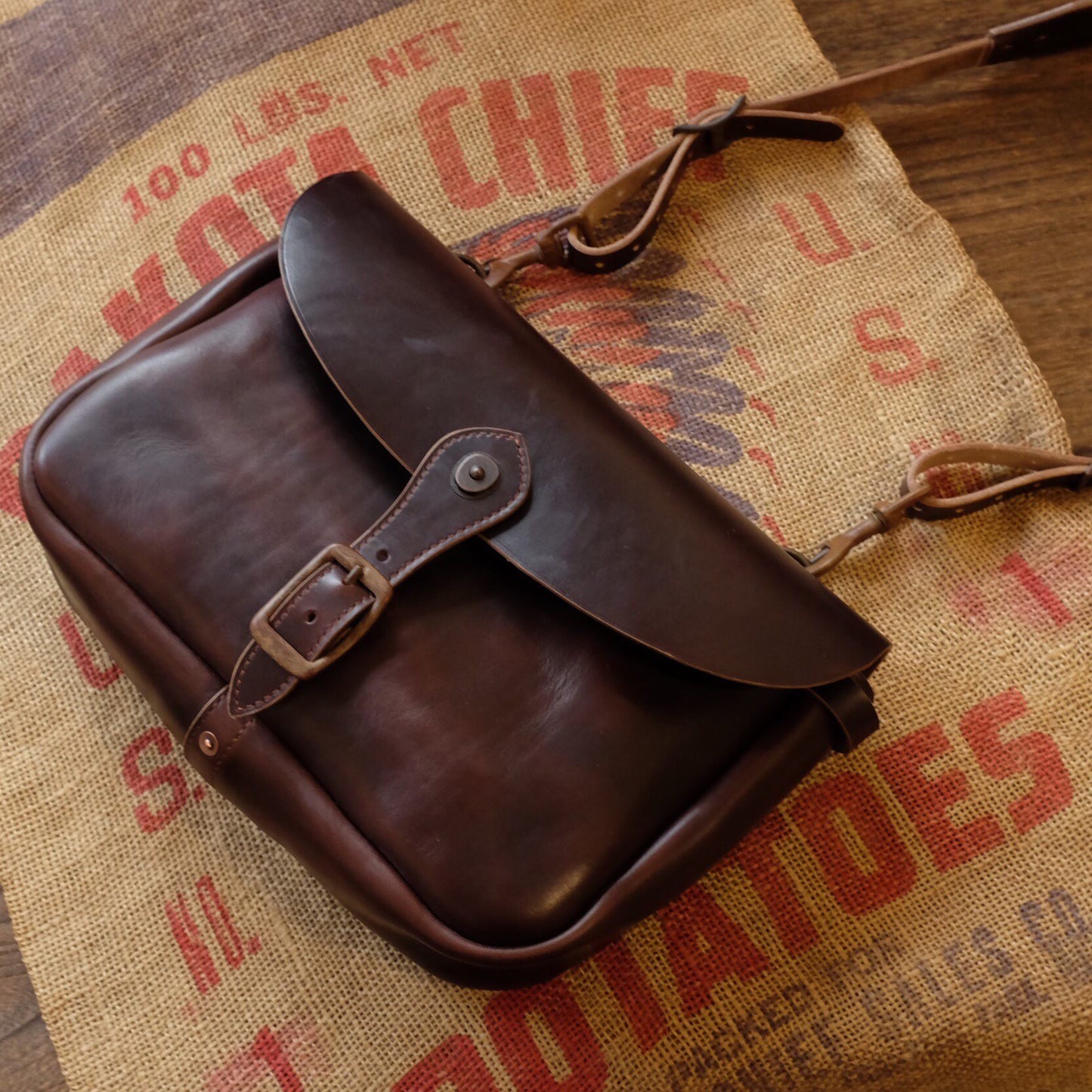 Rich Brown Leather Messenger Bag with Brass Buckle Closure