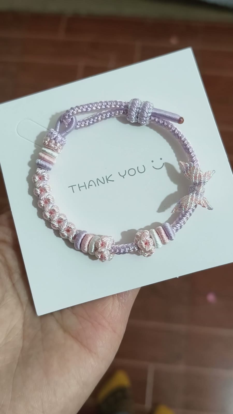 Handgeweven roze-naar-lila cord armband