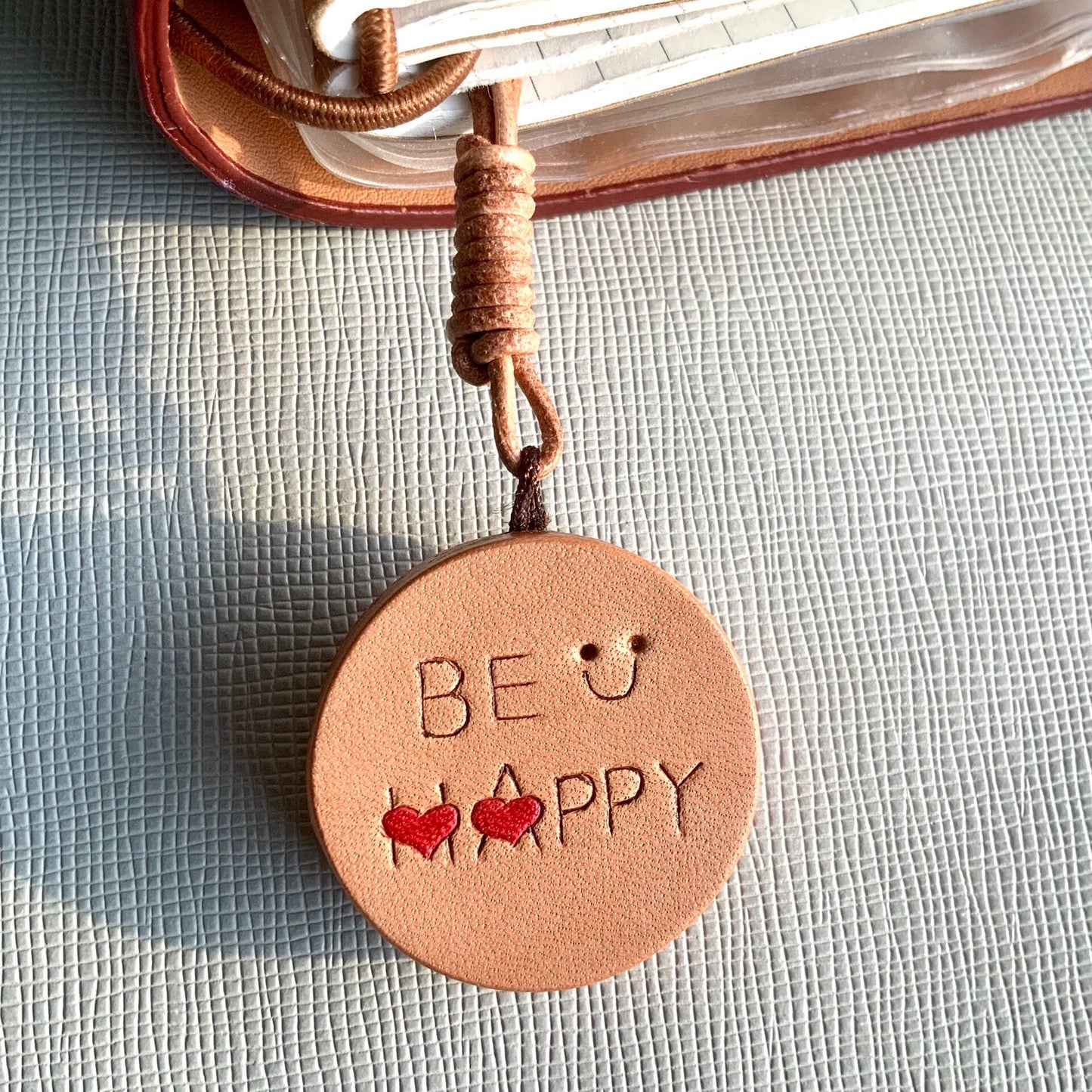 Handcrafted Leather Pendants: "BE HAPPY" Disc and Whale Charm