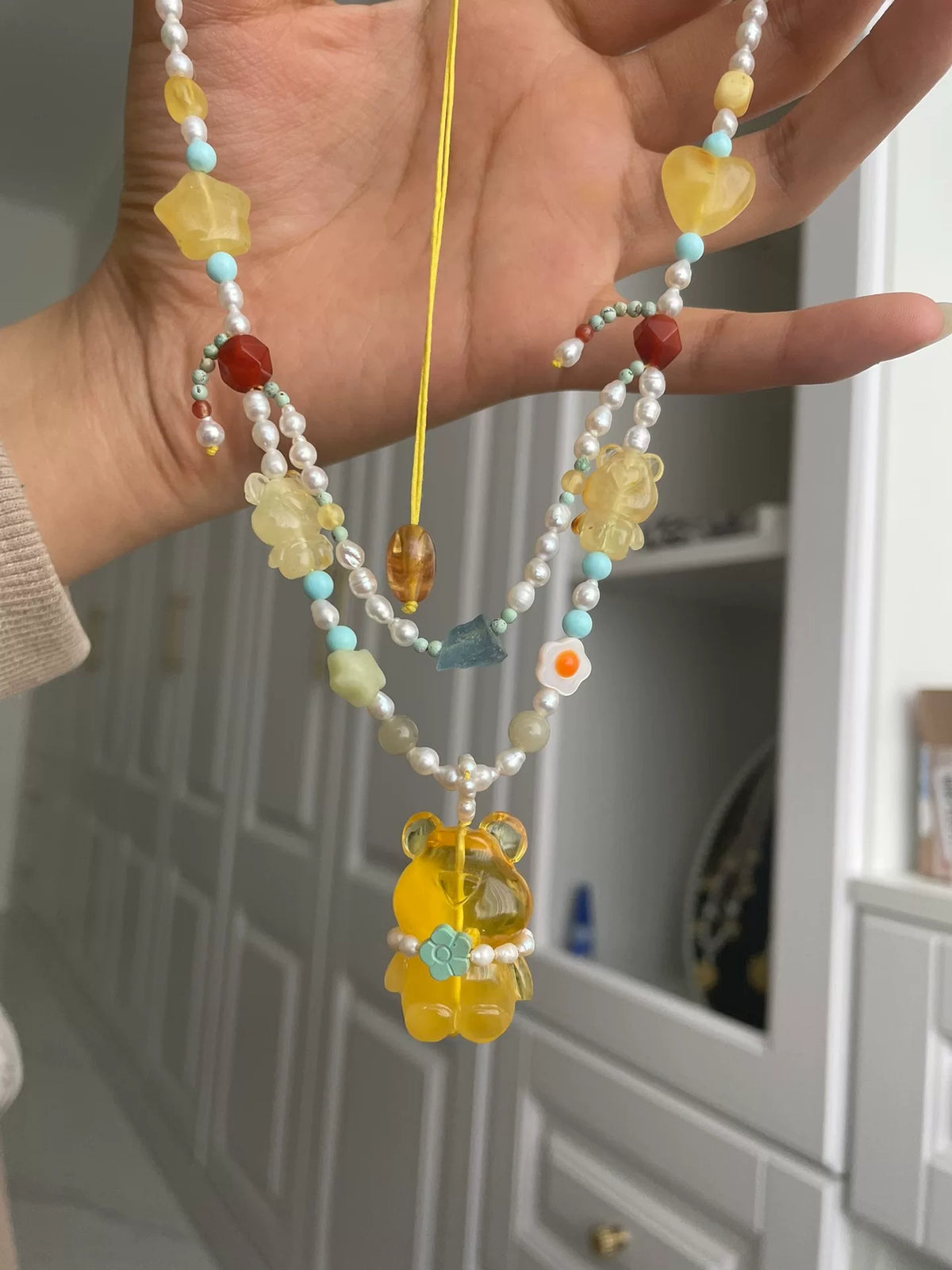 Collier double rang ours en ambre, perles et turquoise