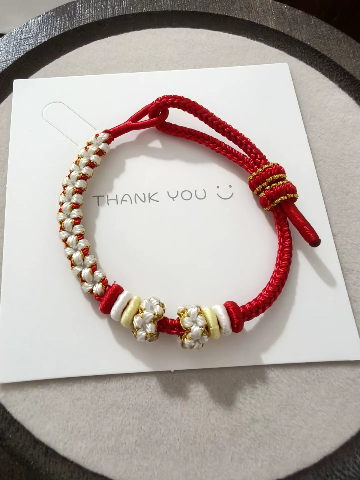Bracciale Intrecciato a Mano Rosso, Bianco e Oro