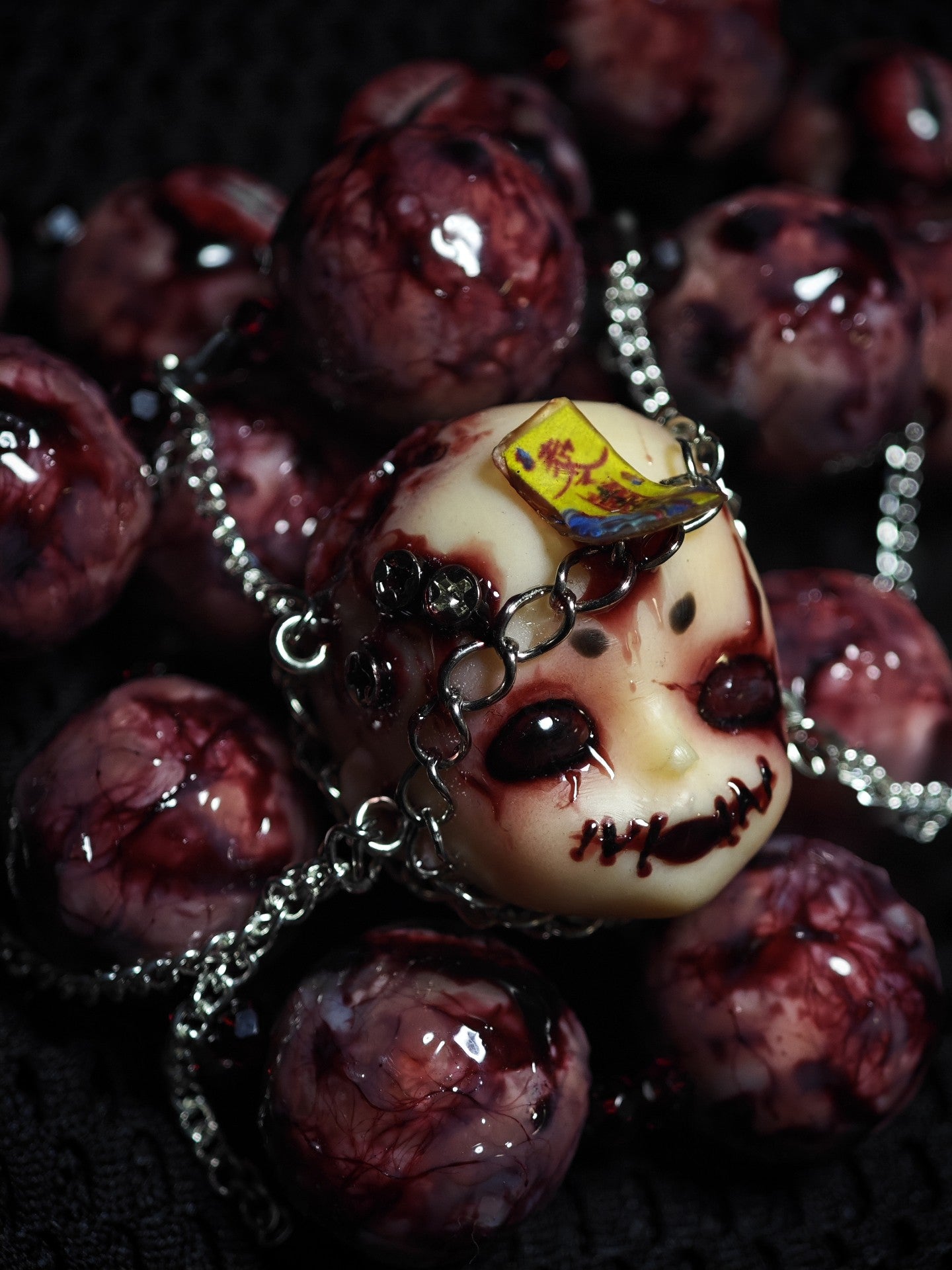 Handcrafted Doll Head Pendant with Eye Beads and Chain