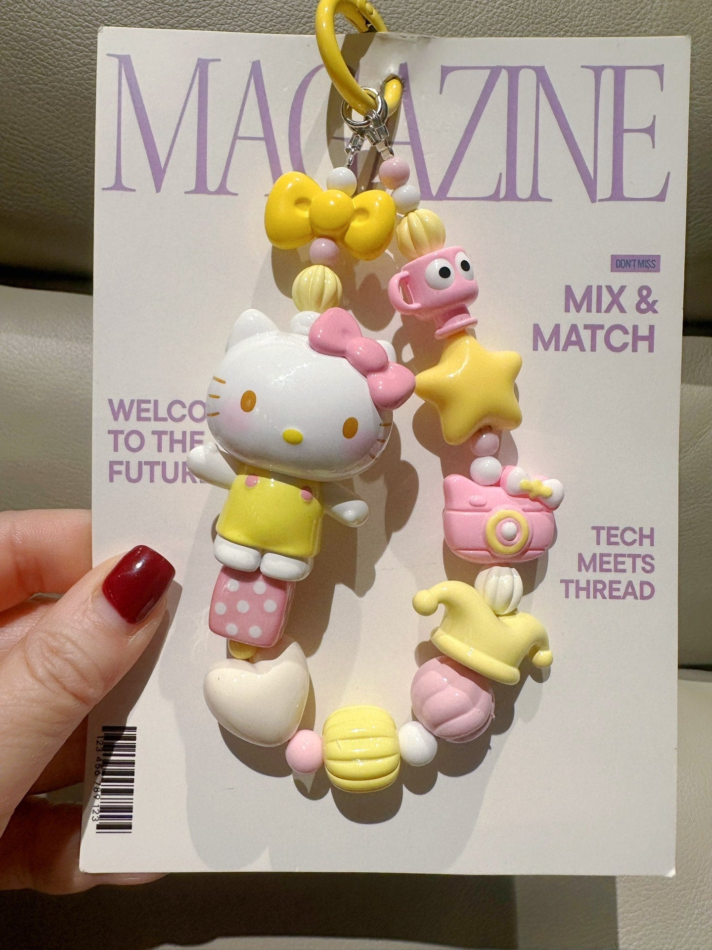 Sanrio White Cat Keychain with Yellow Outfit and Pastel Charms