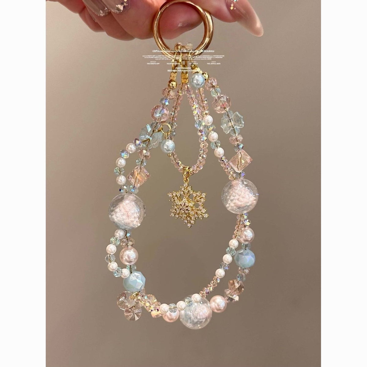 Beaded Phone Charm with Snowflake Motif