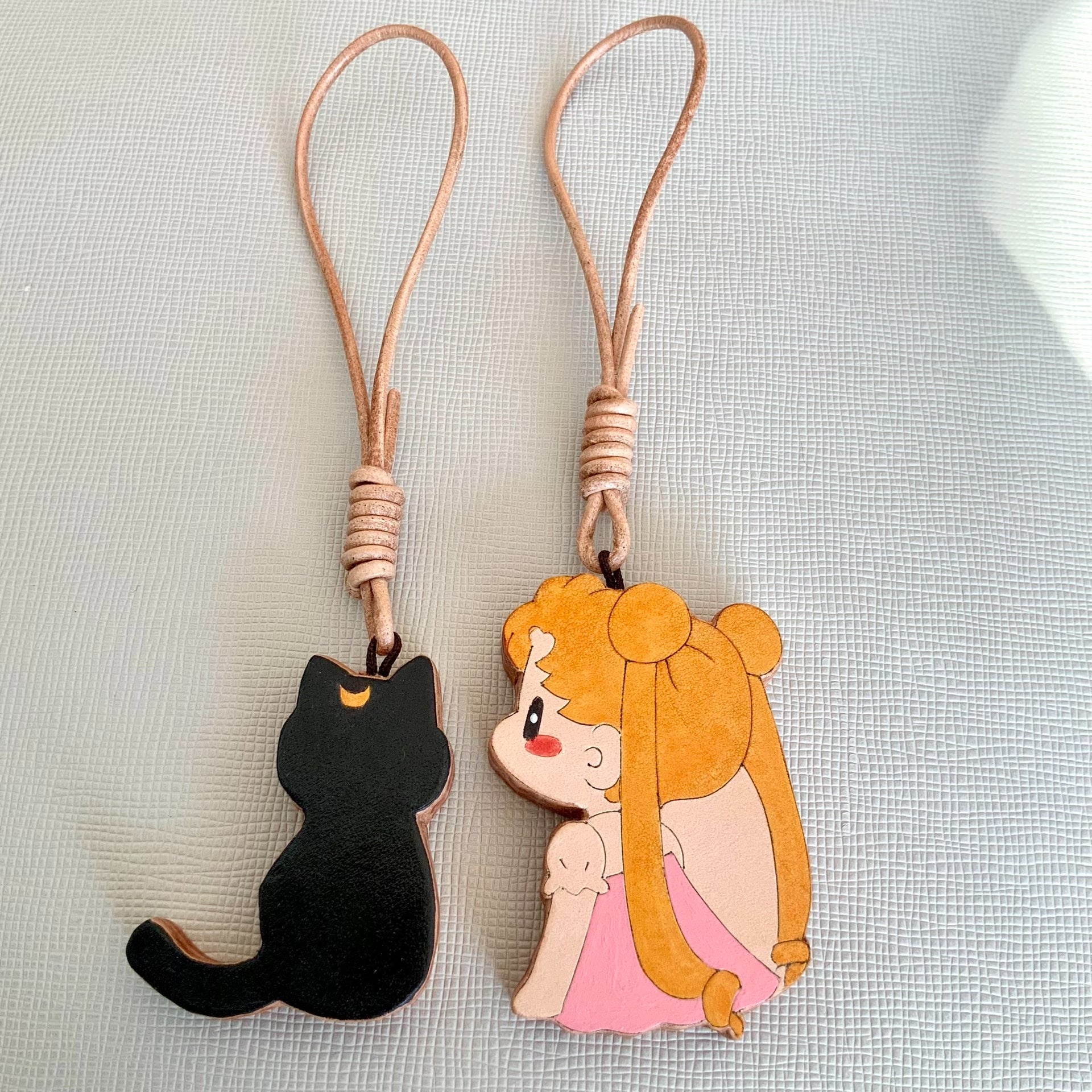 Two Thick Leather Keychain Pendants: Black Cat and Blonde Girl