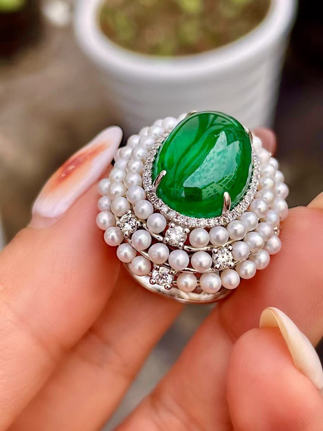 18k Gold Ring with 11.8ct Cabochon Emerald, 0.71ct Diamond Halo, and Pearl Border