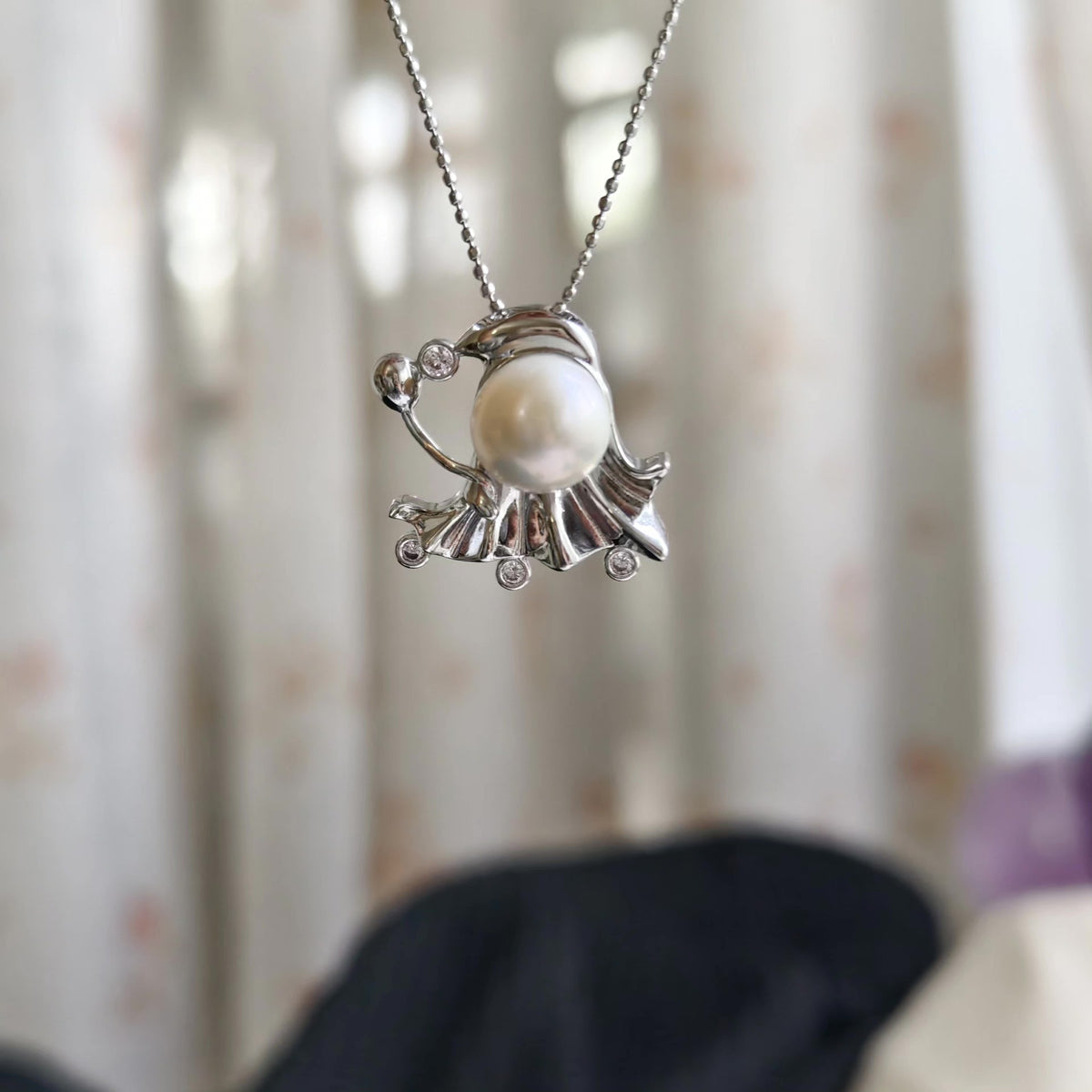 Collier fantôme avec pendentif perle naturelle